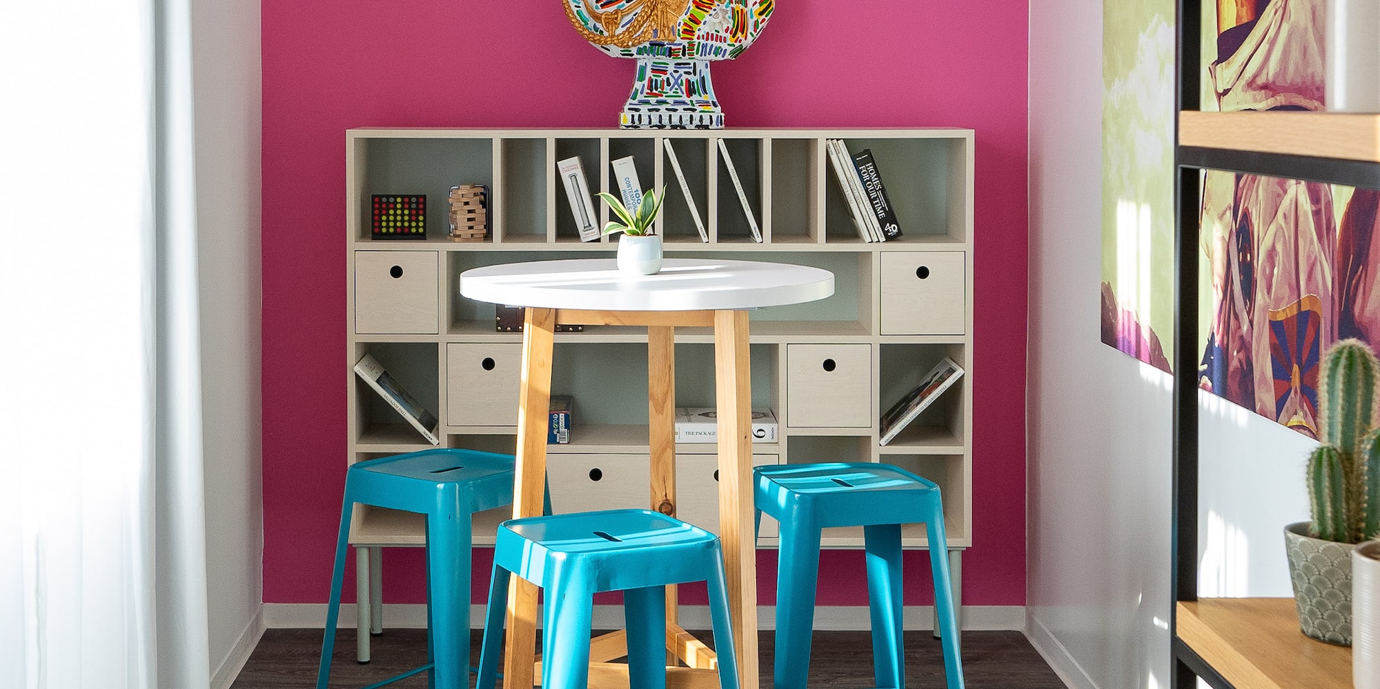 a room with a table and stools