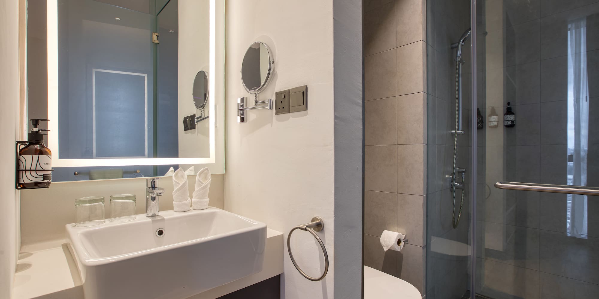 a bathroom with a mirror and sink