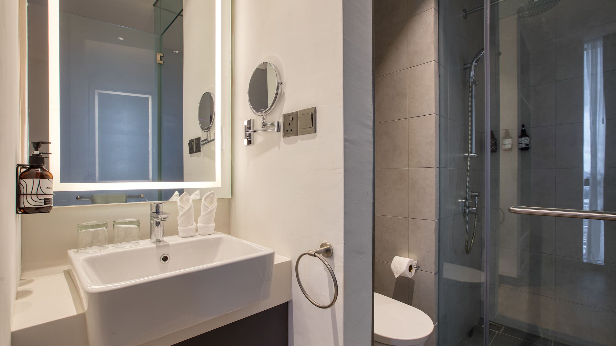 a bathroom with a mirror and sink