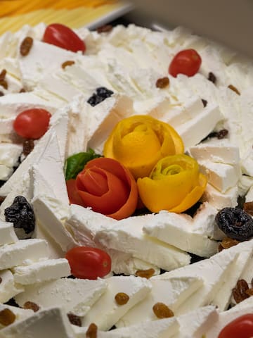 a plate of food with flowers and raisins