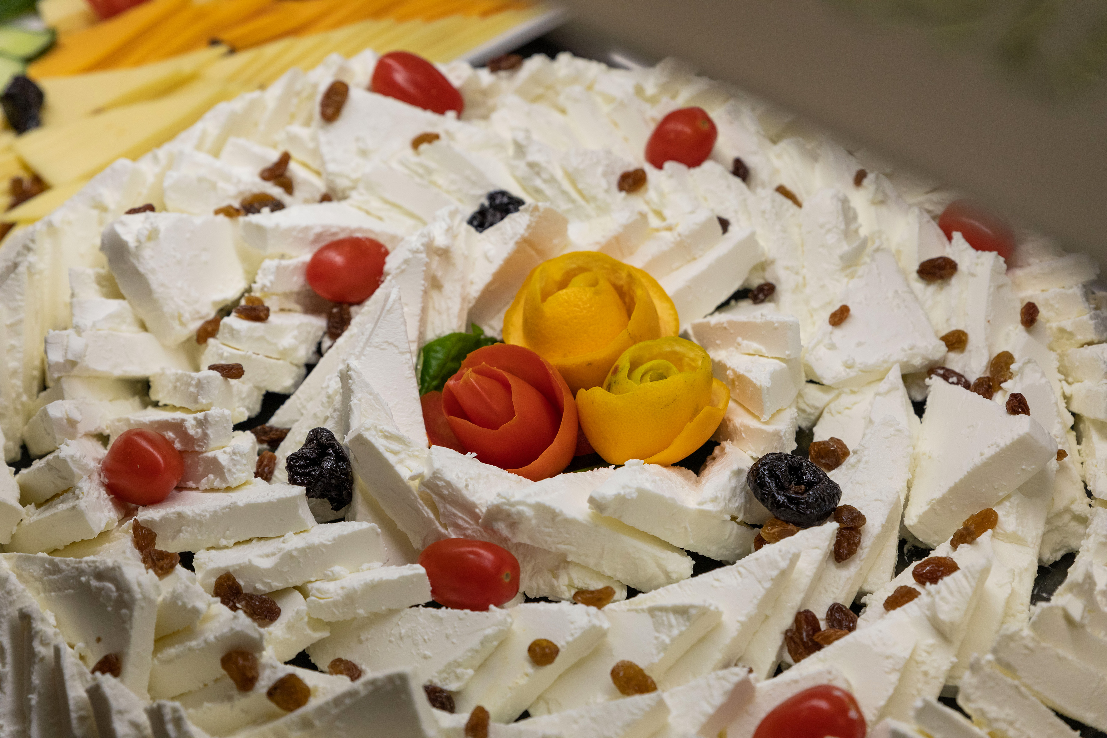 a plate of food with flowers and raisins