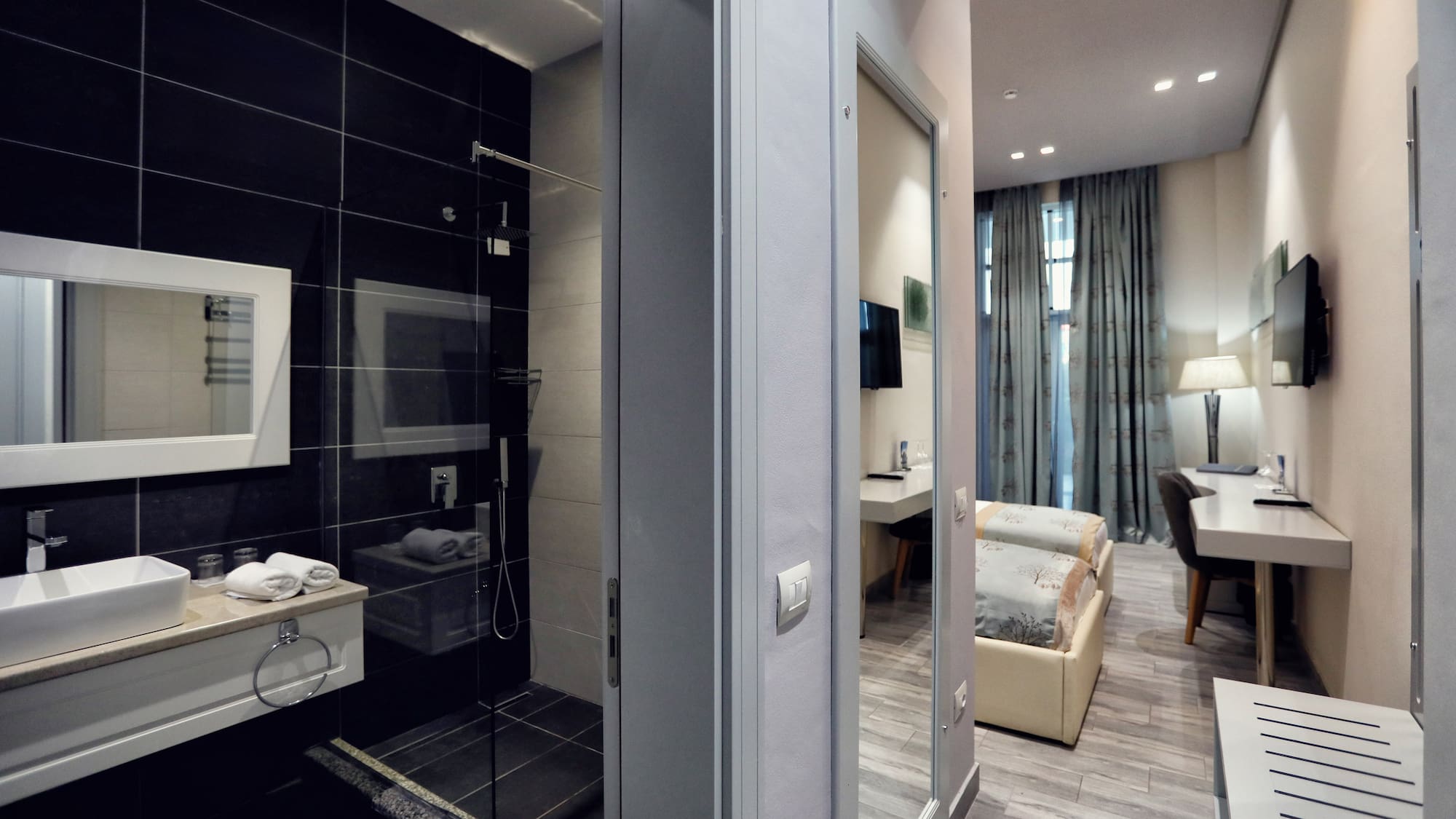 a bathroom with a shower and a bed