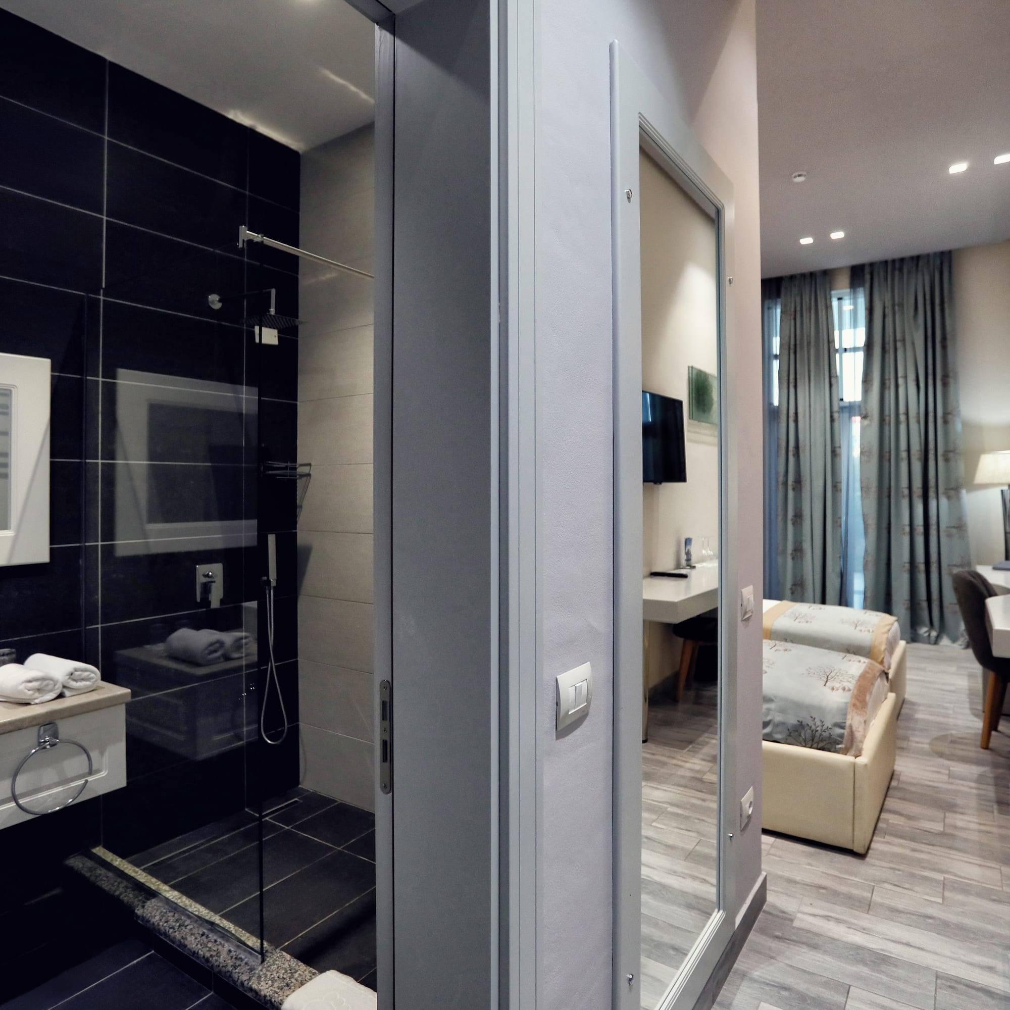 a bathroom with a shower and a bed