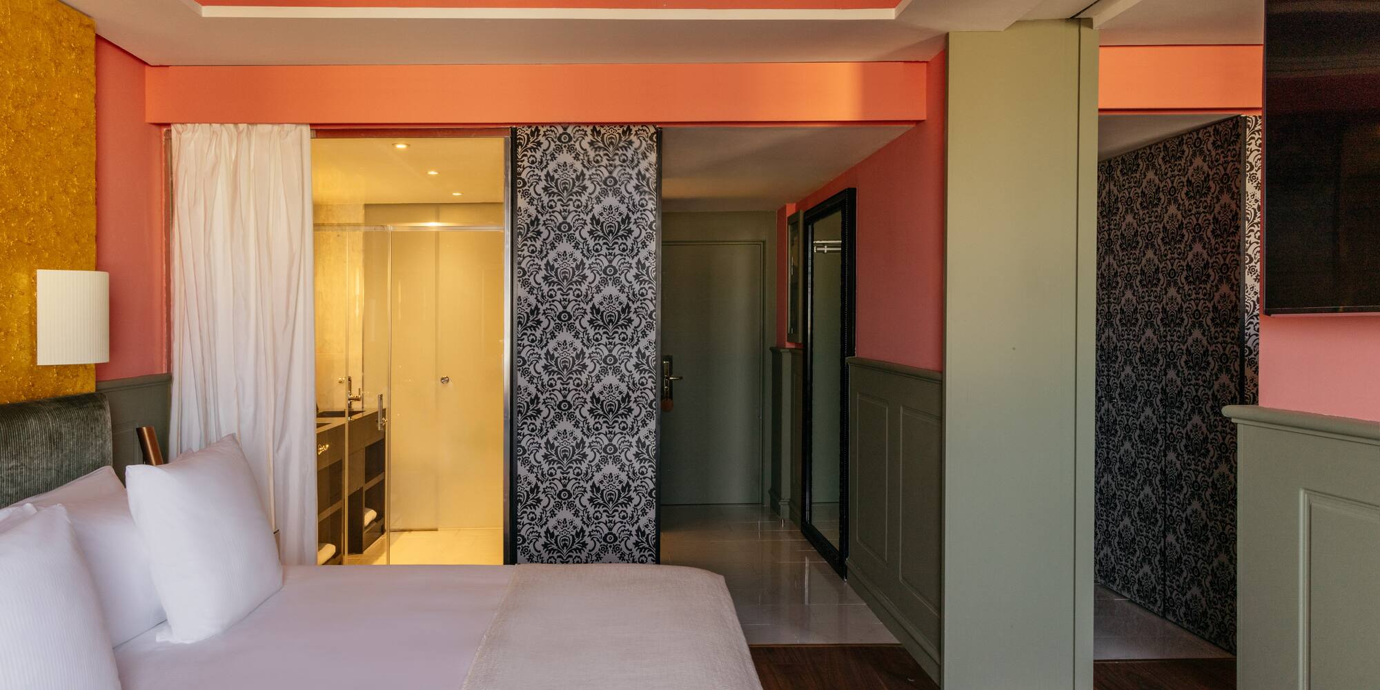 a room with a bed and a shower