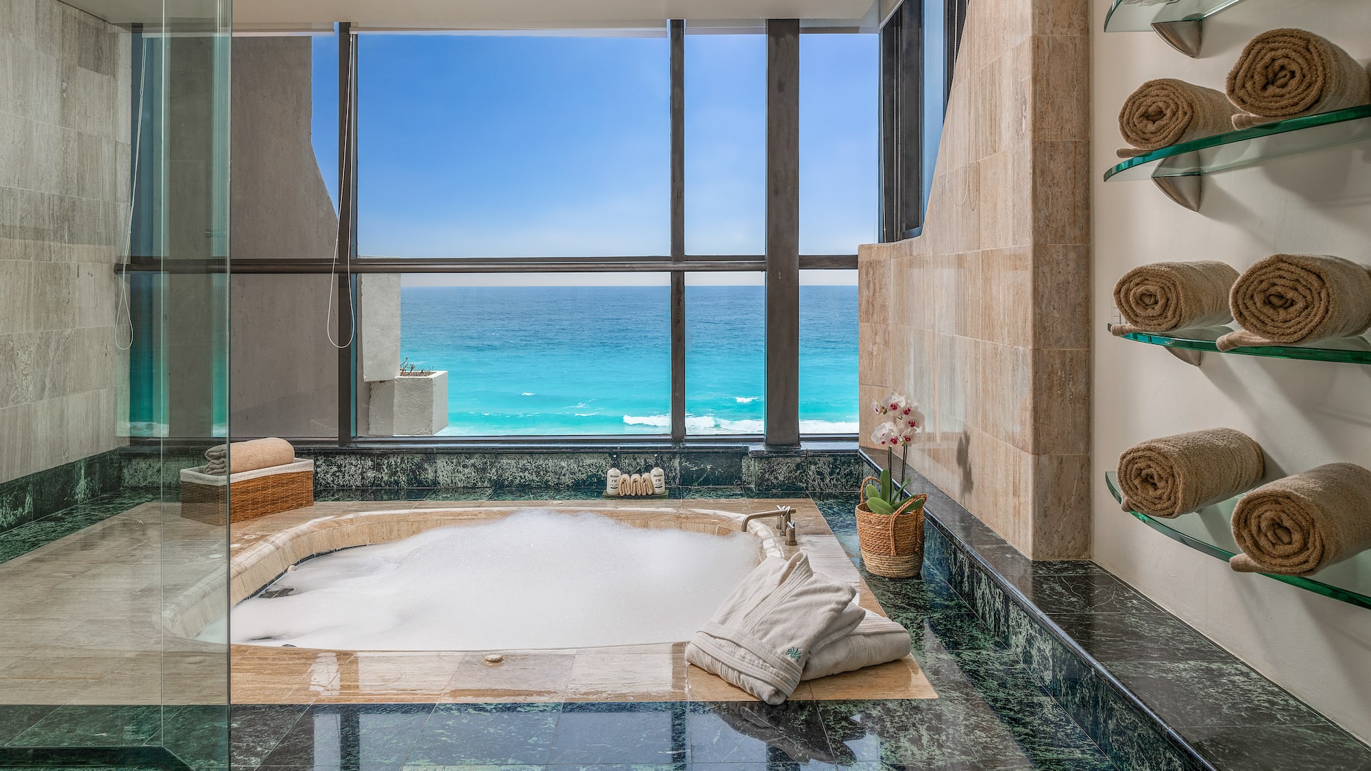 a large jacuzzi with a view of the ocean