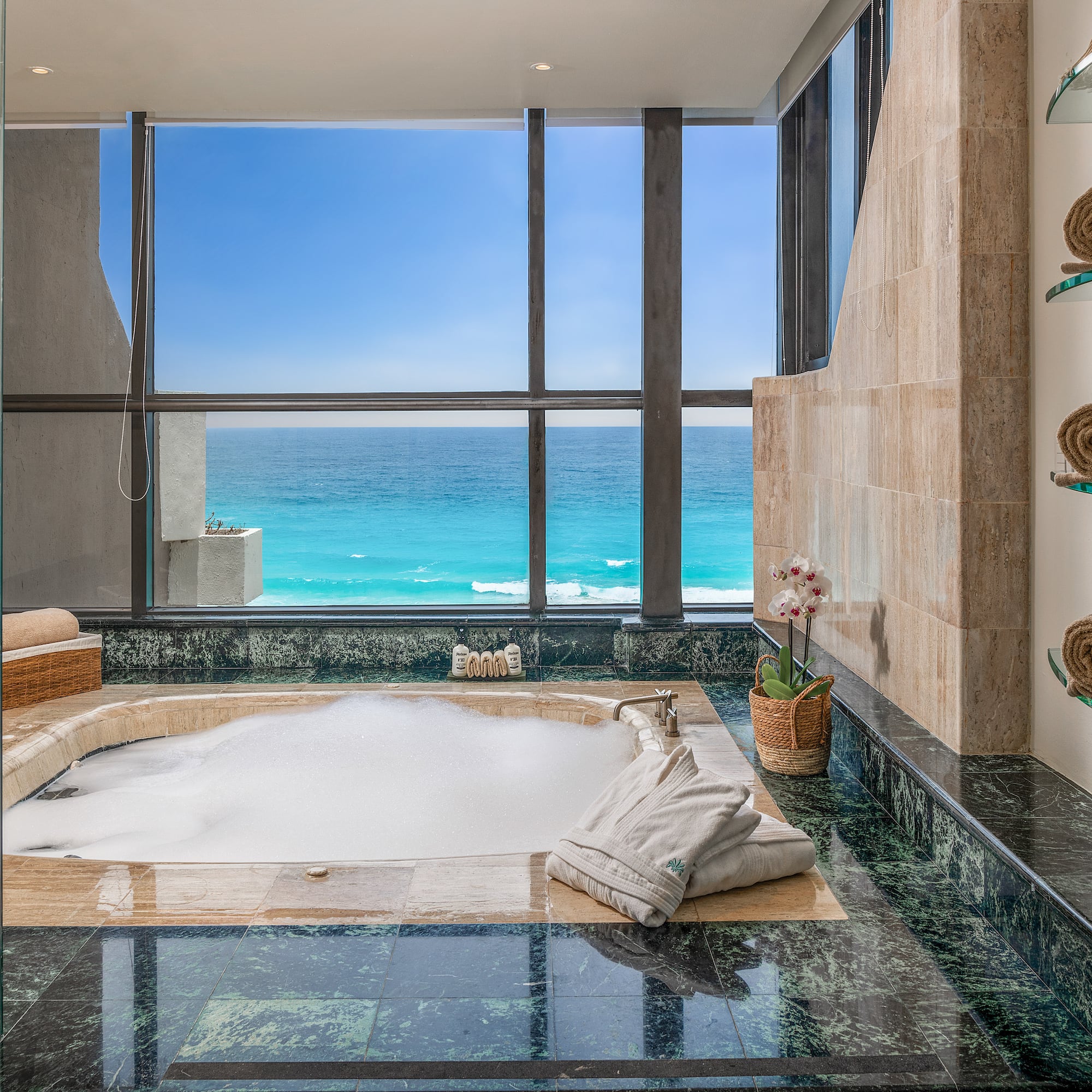a large jacuzzi with a view of the ocean