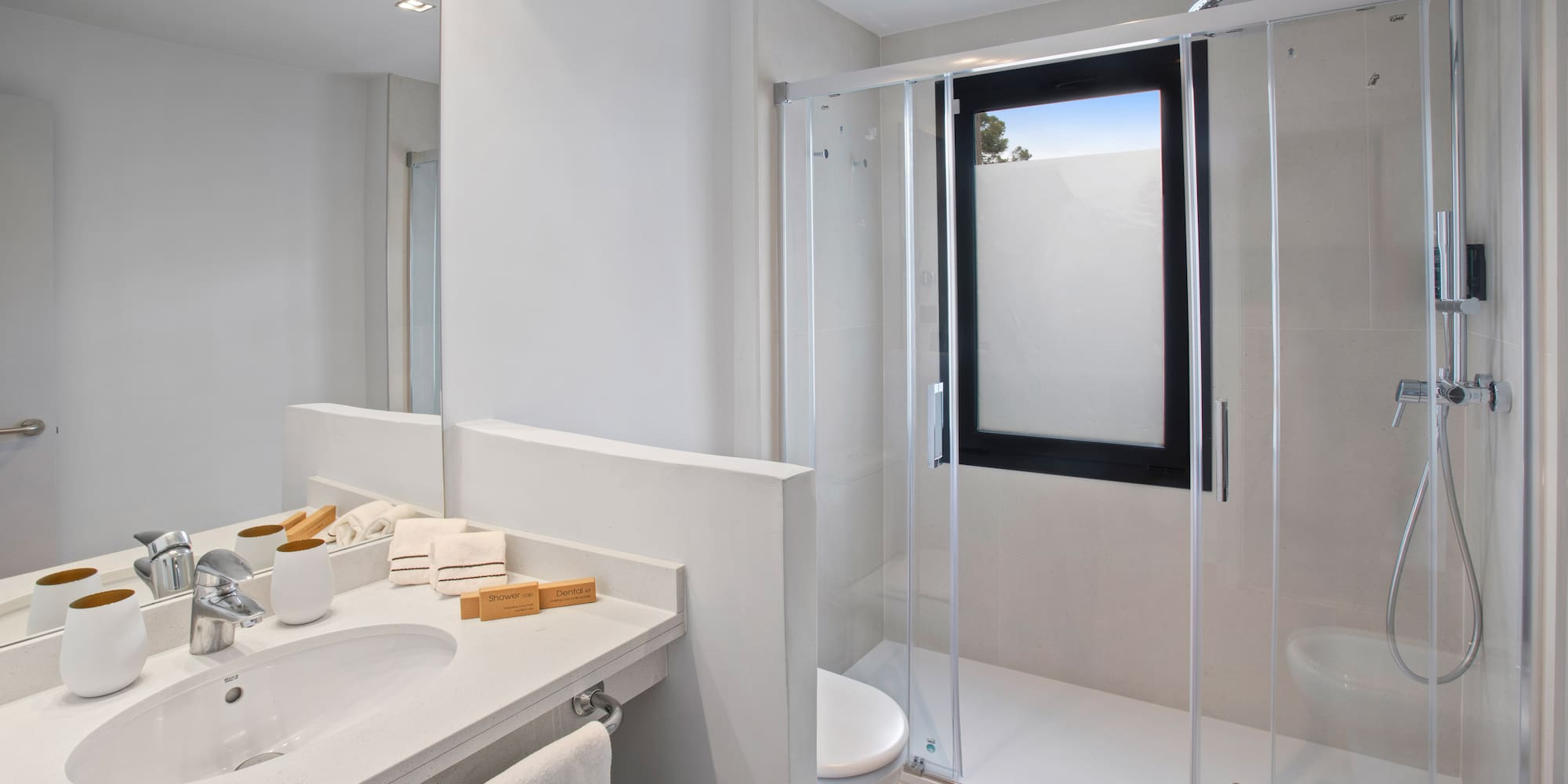 a bathroom with a glass shower door