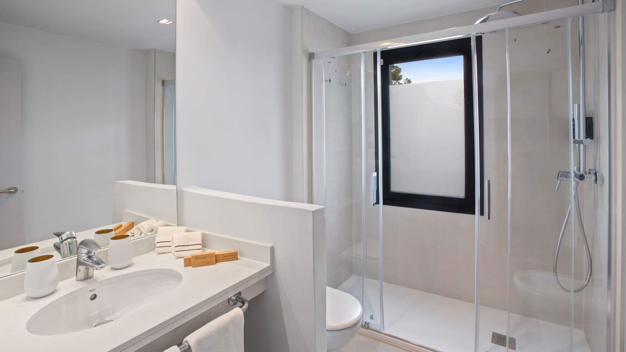 a bathroom with a glass shower door