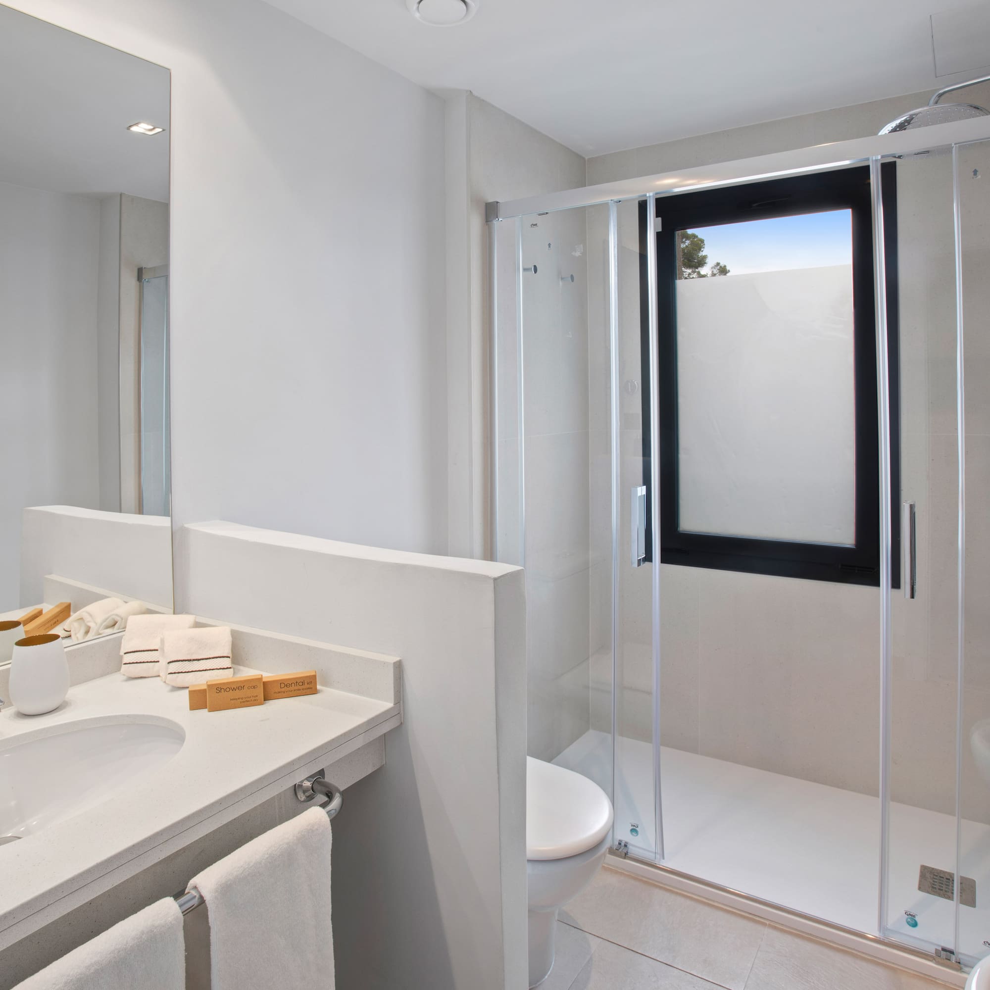 a bathroom with a glass shower door