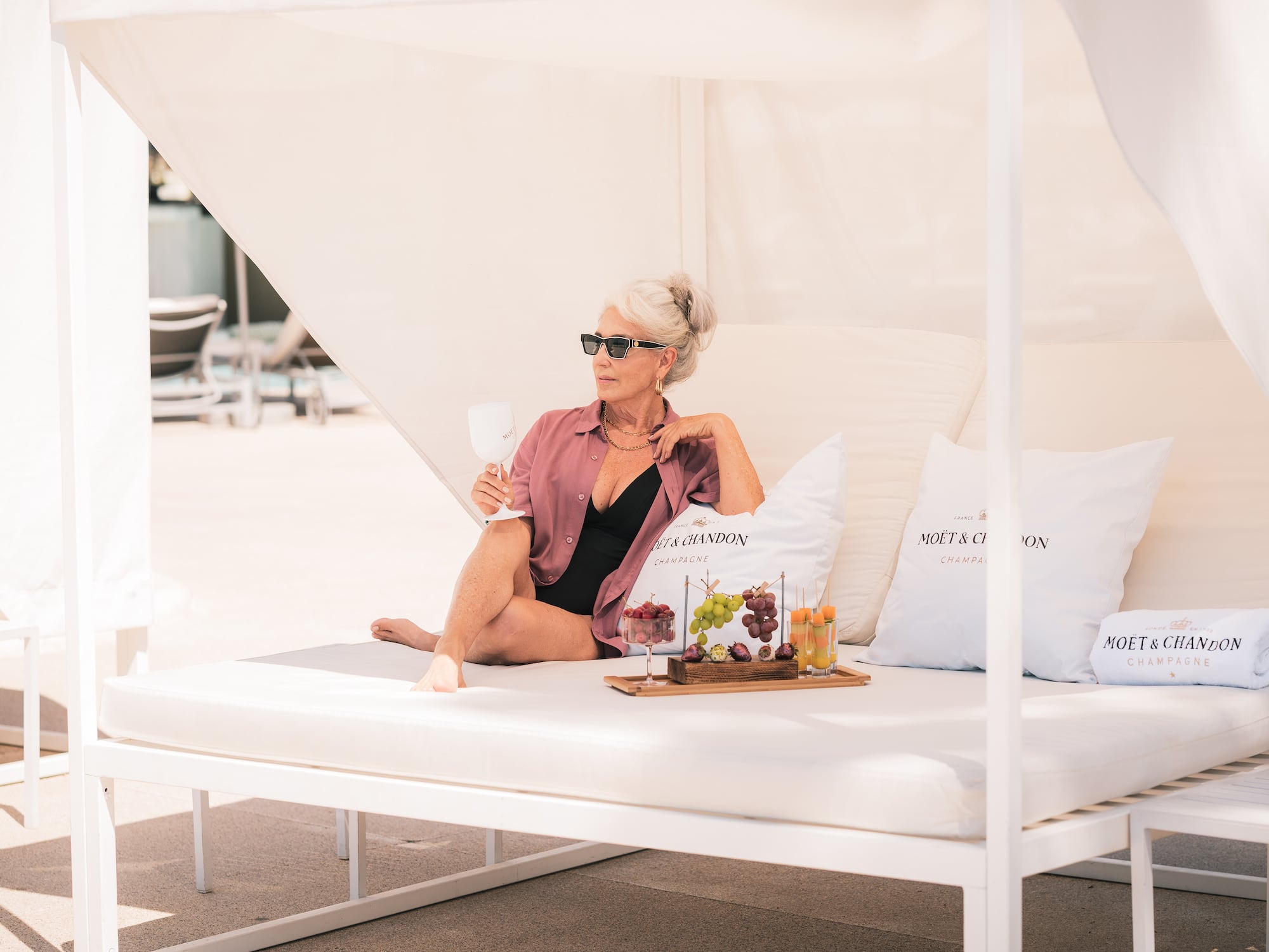a woman sitting on a white couch