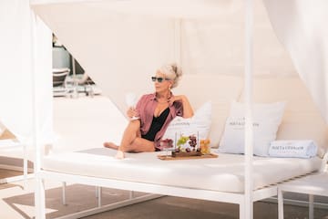 a woman sitting on a white couch