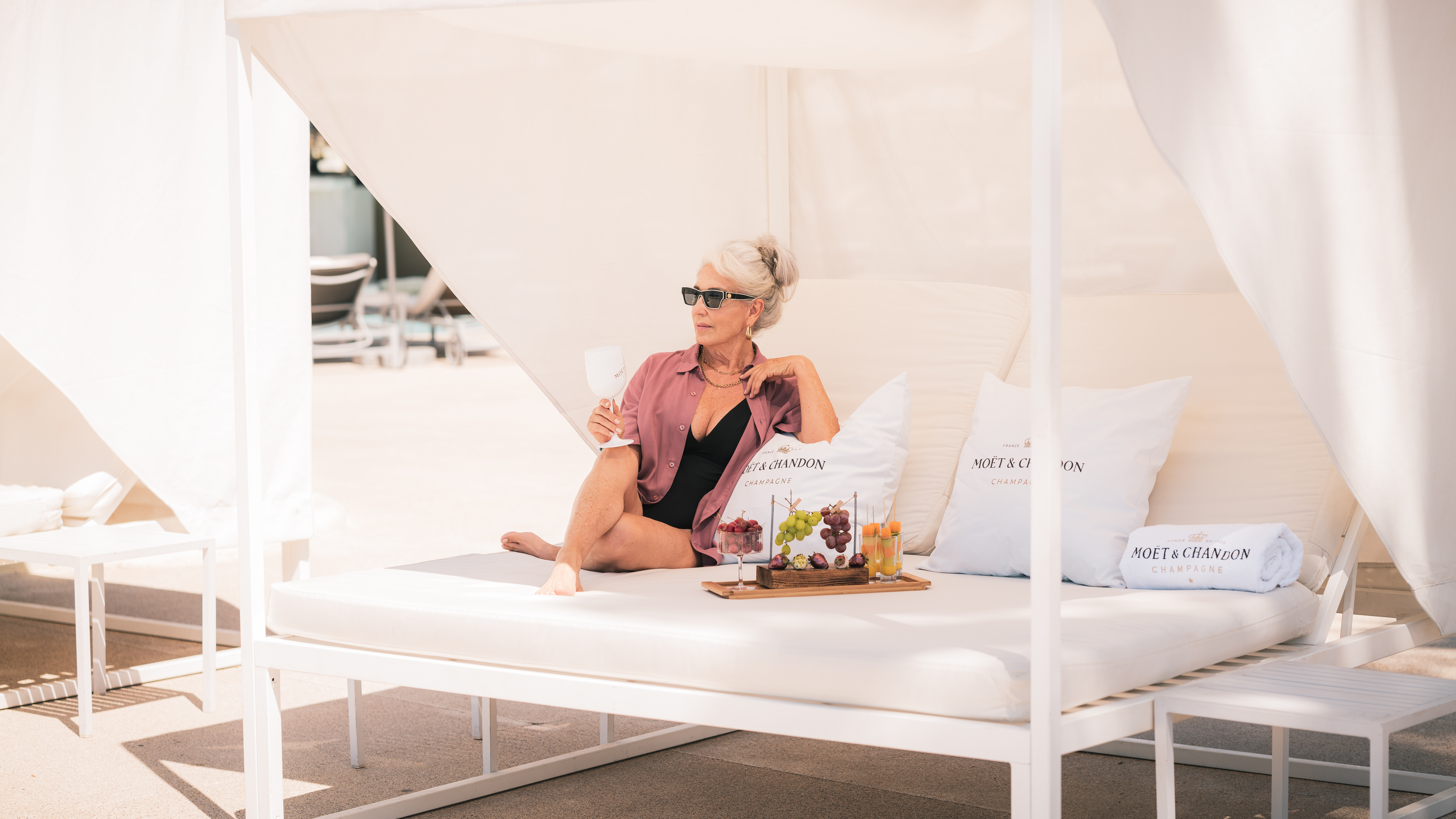 a woman sitting on a white couch