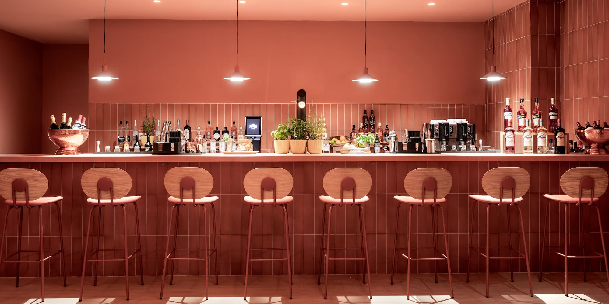 a bar with chairs and lights