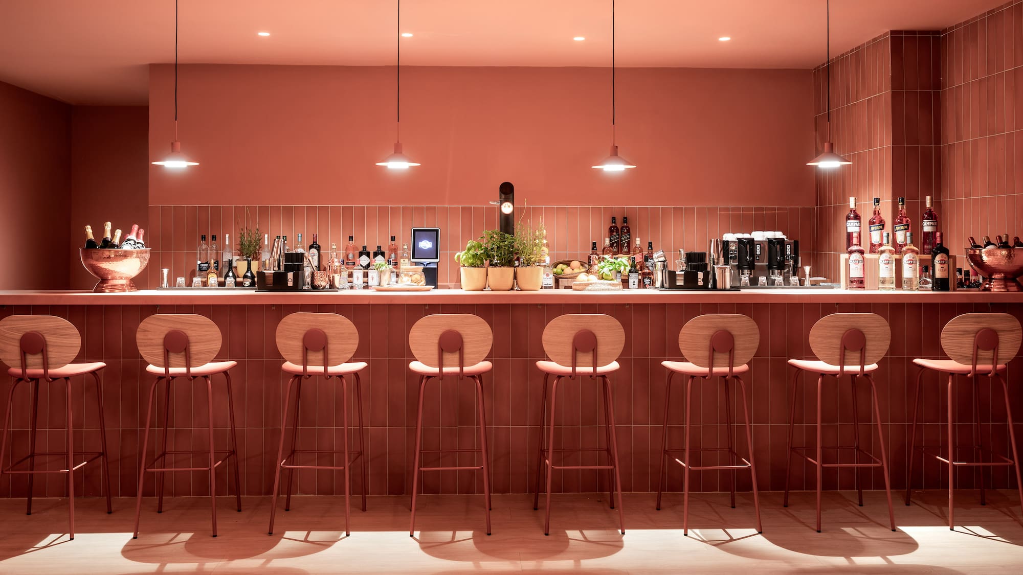 a bar with chairs and lights