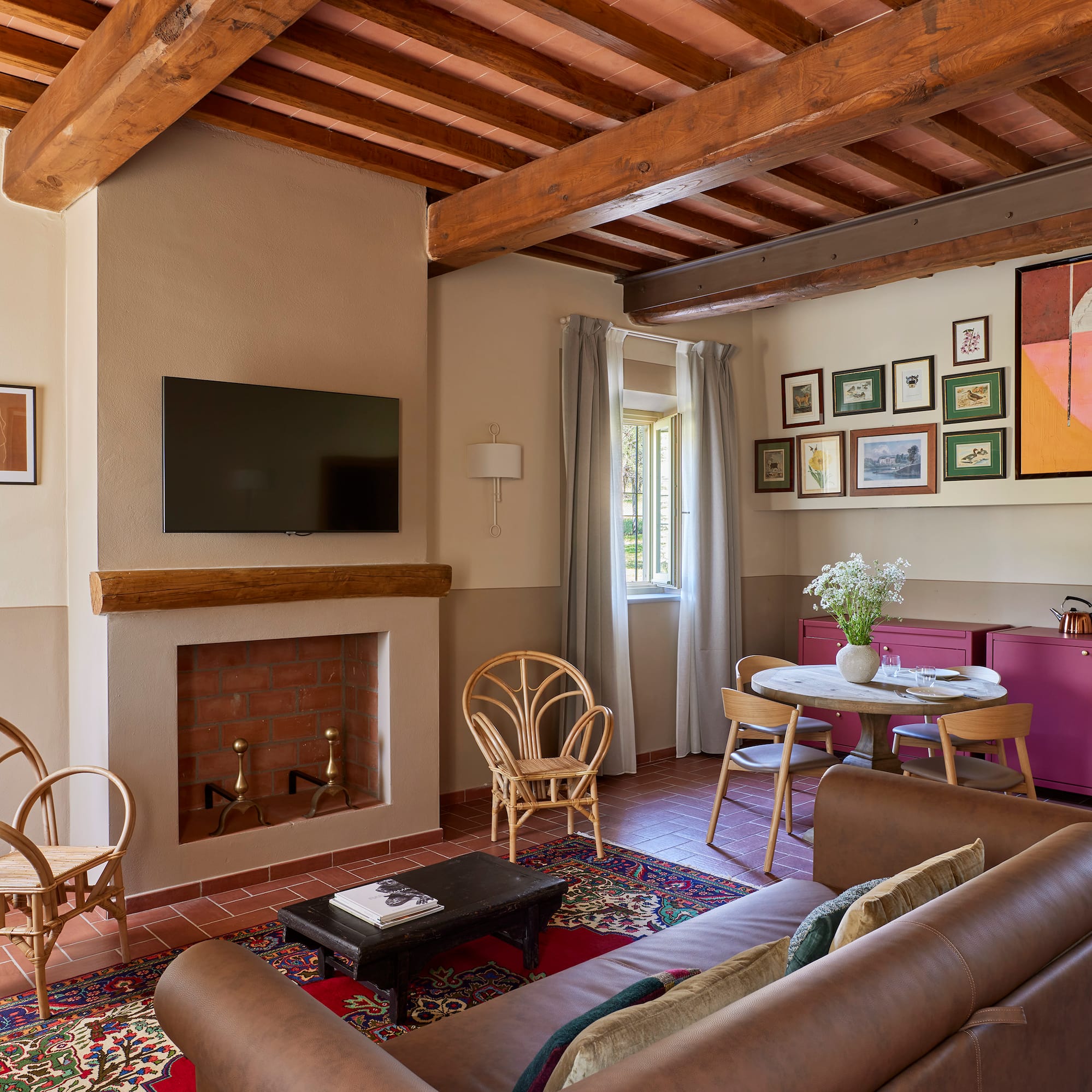 a living room with a fireplace and furniture