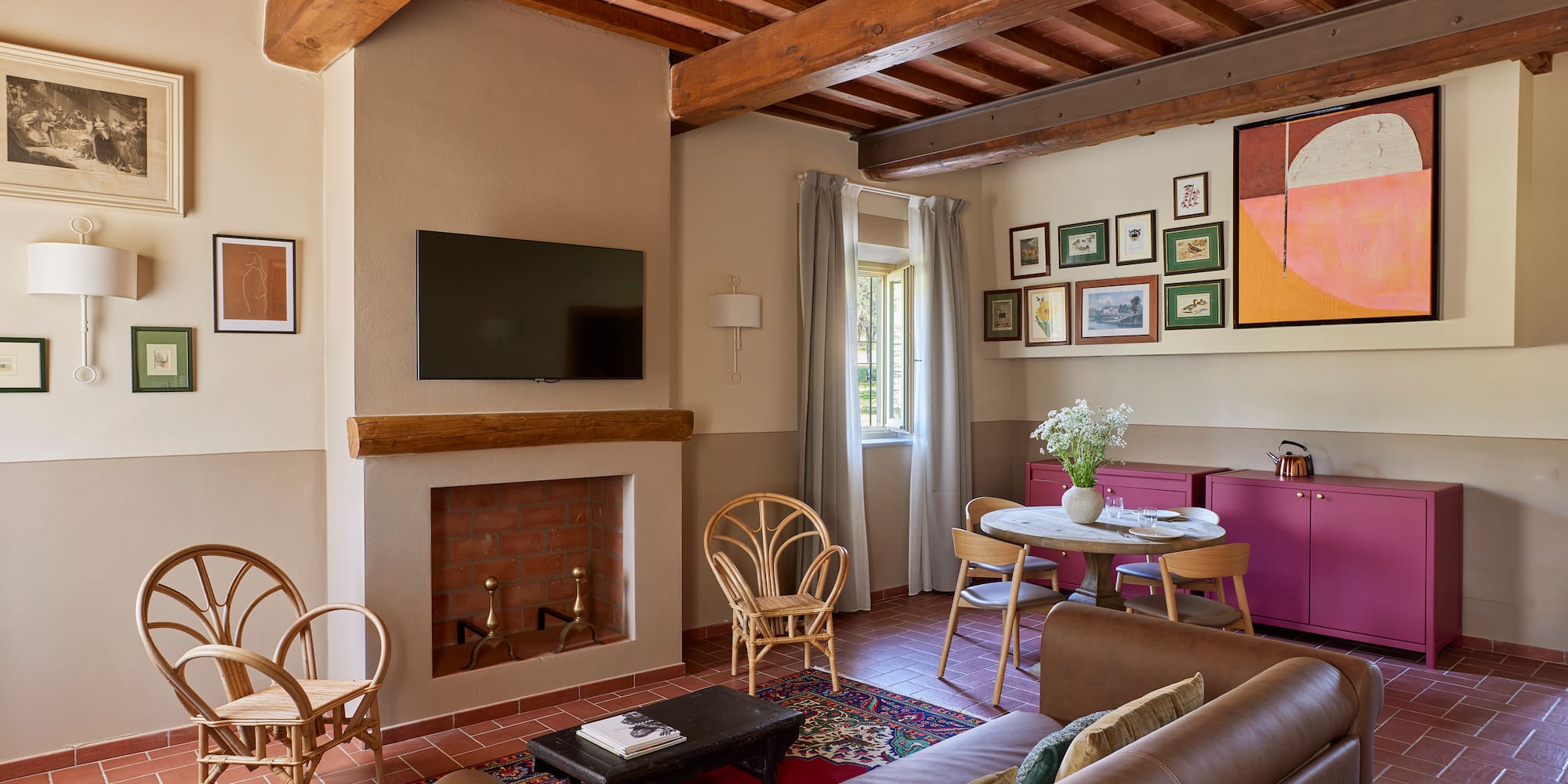 a living room with a fireplace and furniture