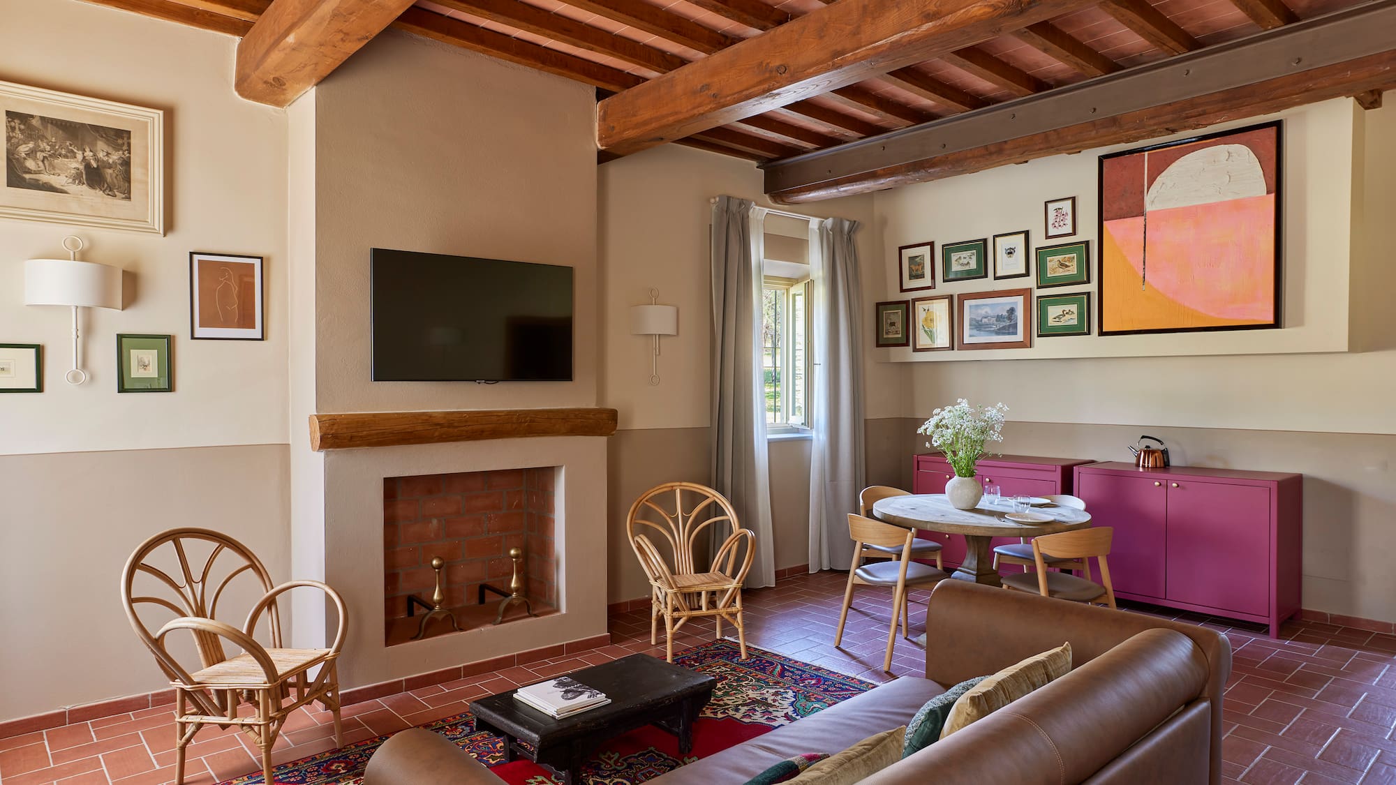 a living room with a fireplace and furniture