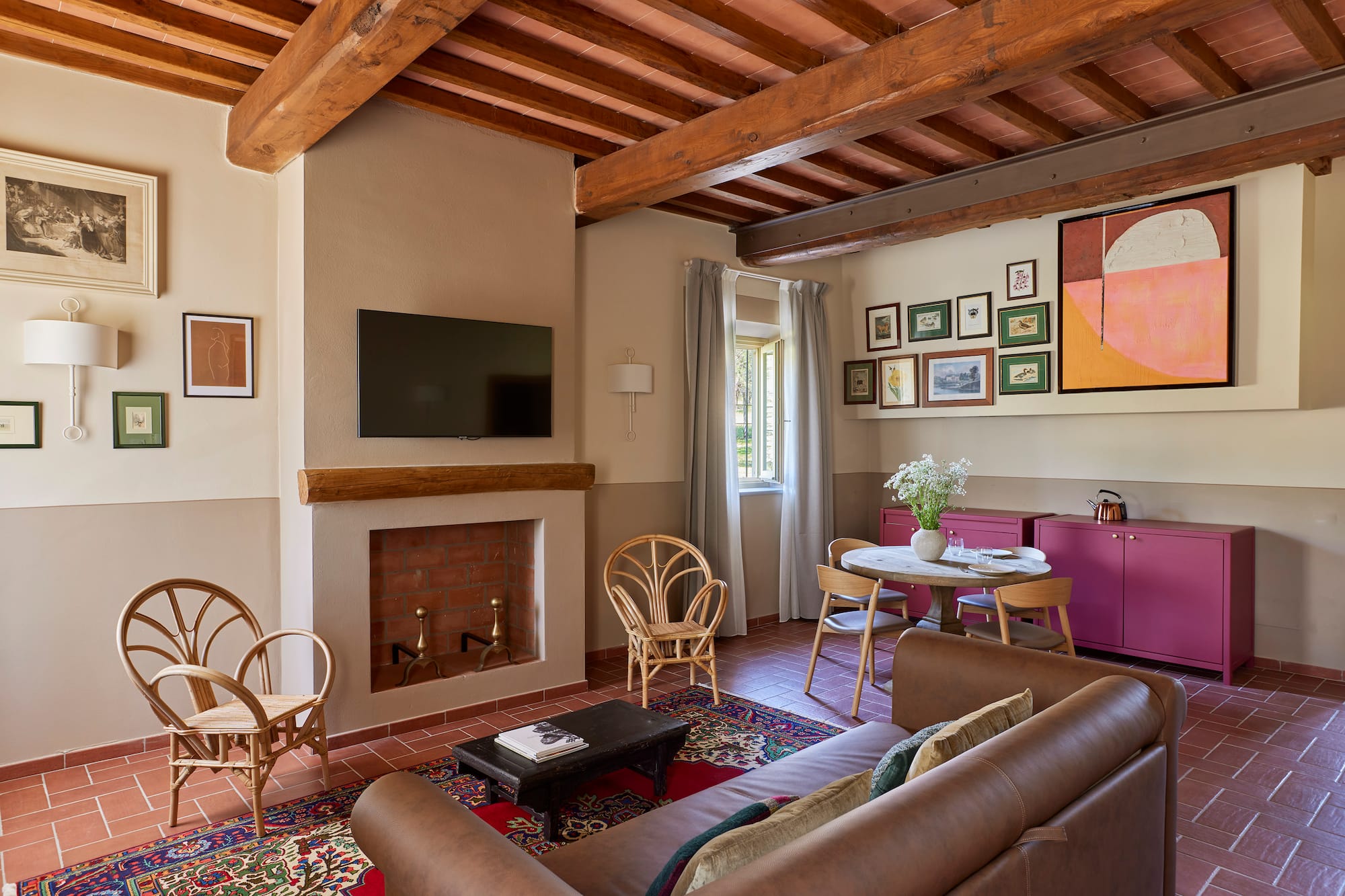 a living room with a fireplace and furniture