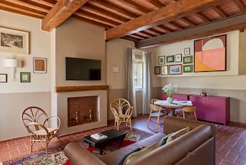 a living room with a fireplace and furniture