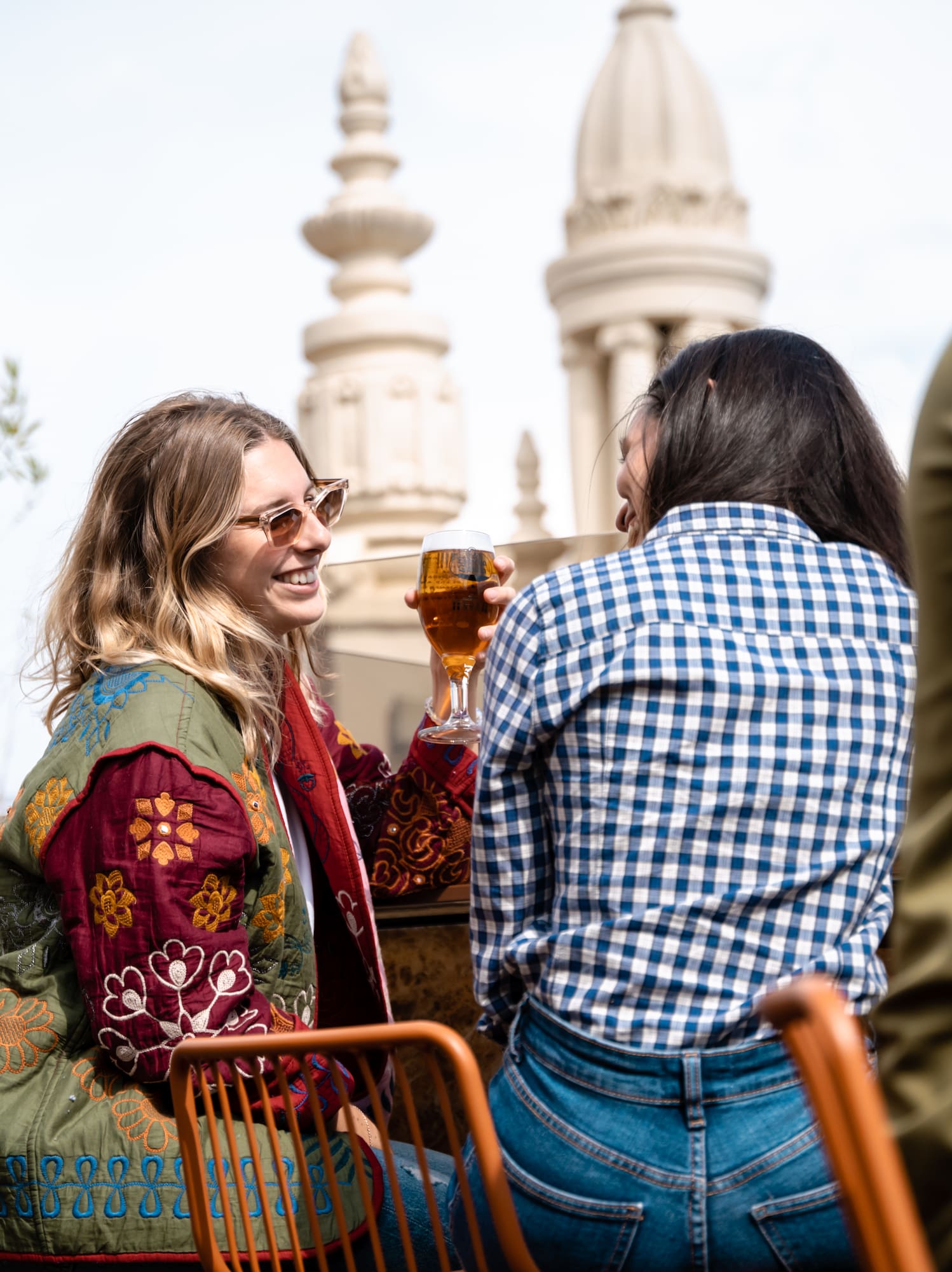 a group of women sitting at a table with drinks