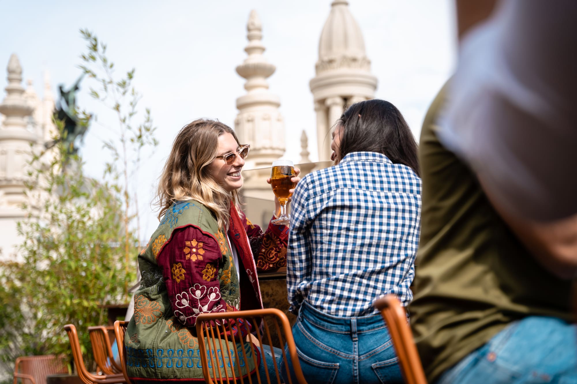 a group of women sitting at a table with drinks