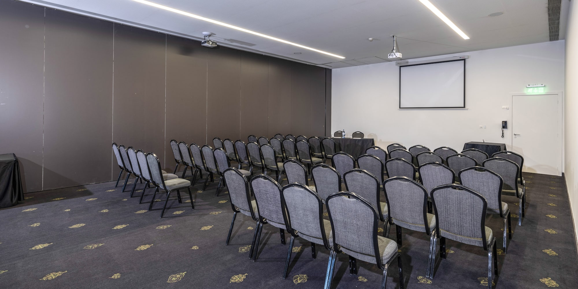 a room with rows of chairs