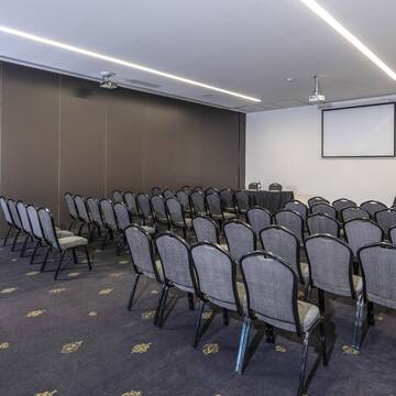 a room with rows of chairs