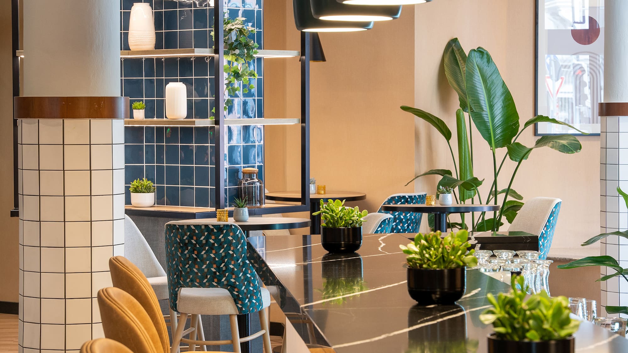 a room with a bar and chairs