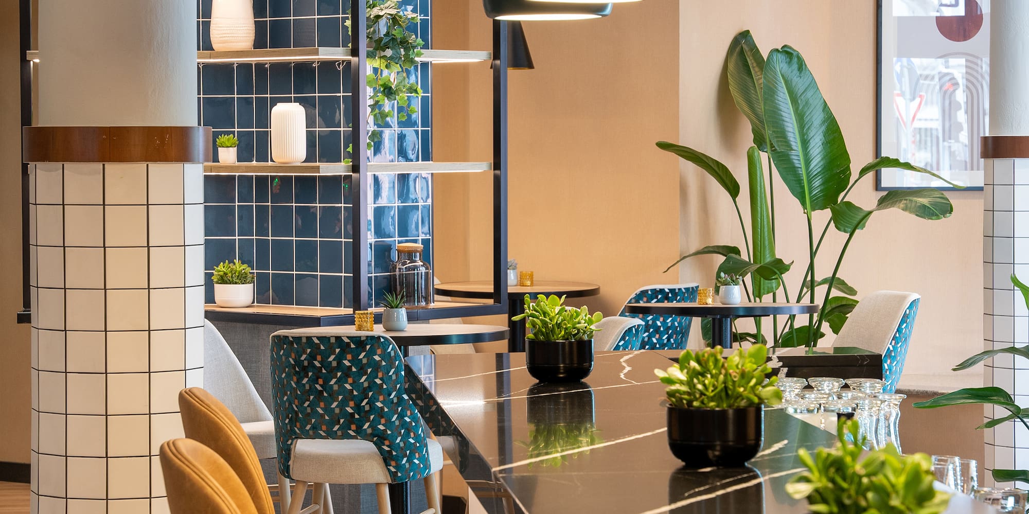 a room with a bar and chairs