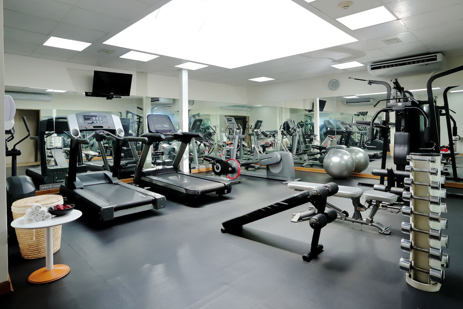 a large room with exercise equipment