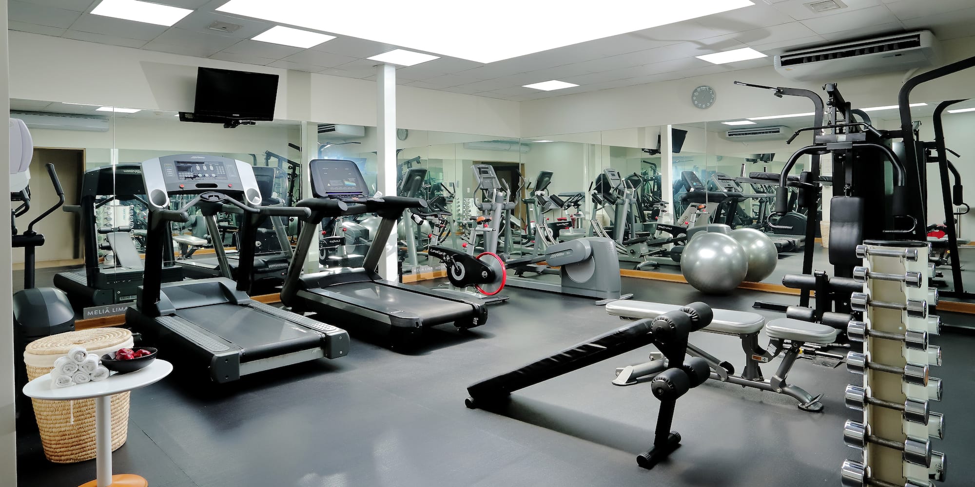 a large room with exercise equipment