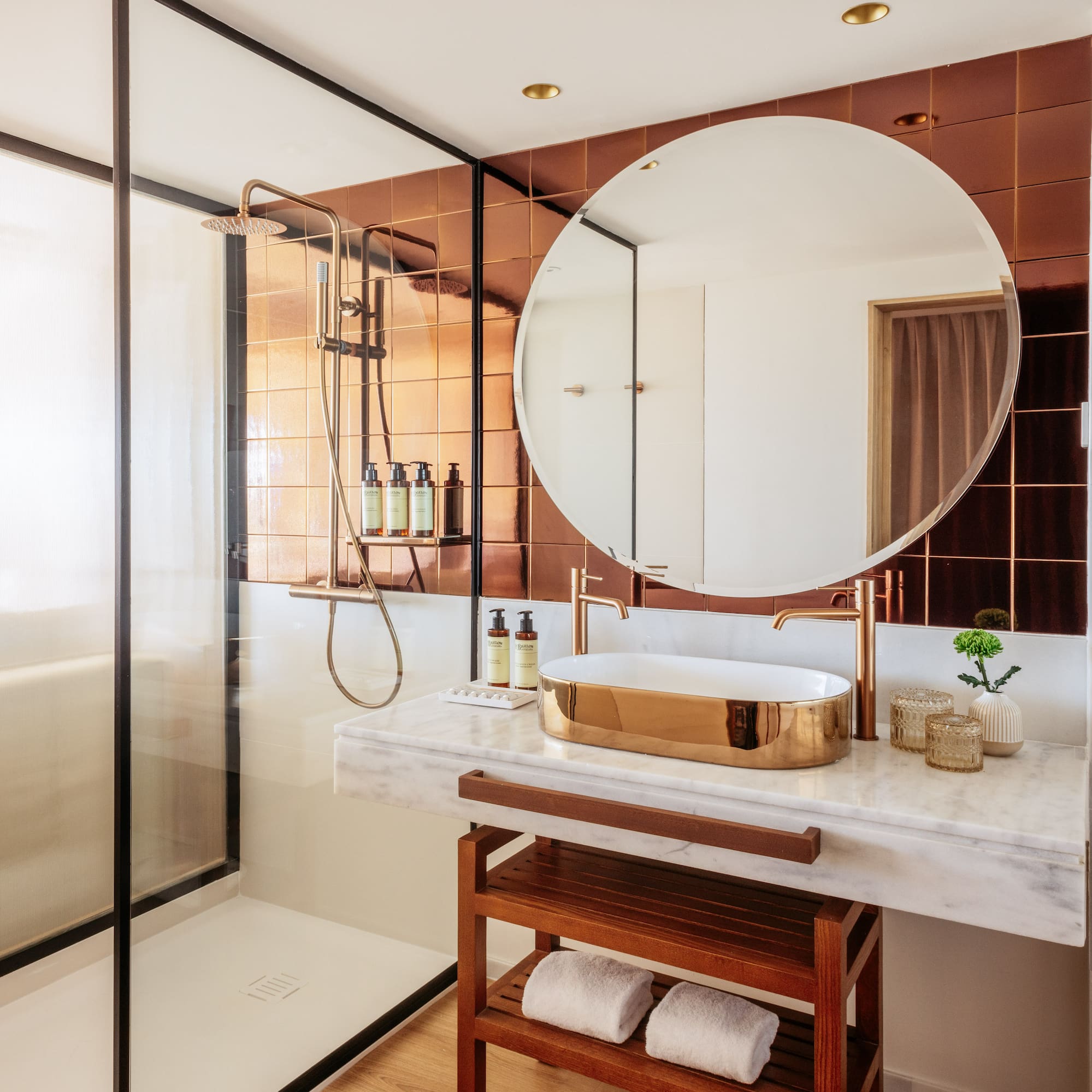 a bathroom with a mirror and shower