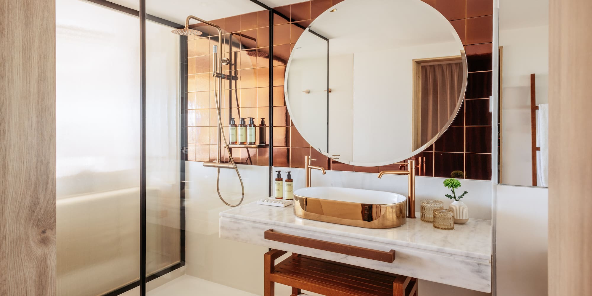a bathroom with a mirror and shower