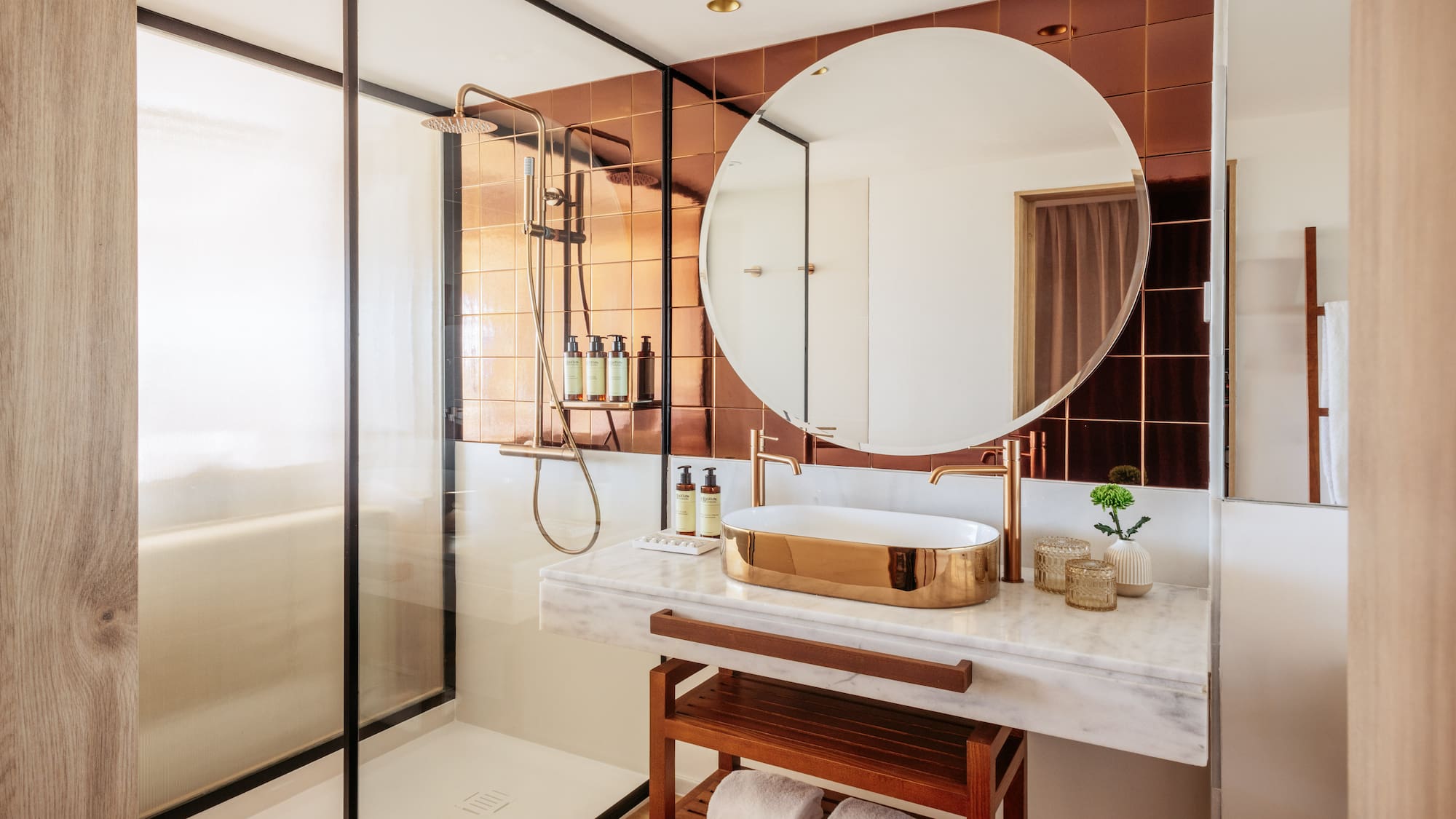 a bathroom with a mirror and shower