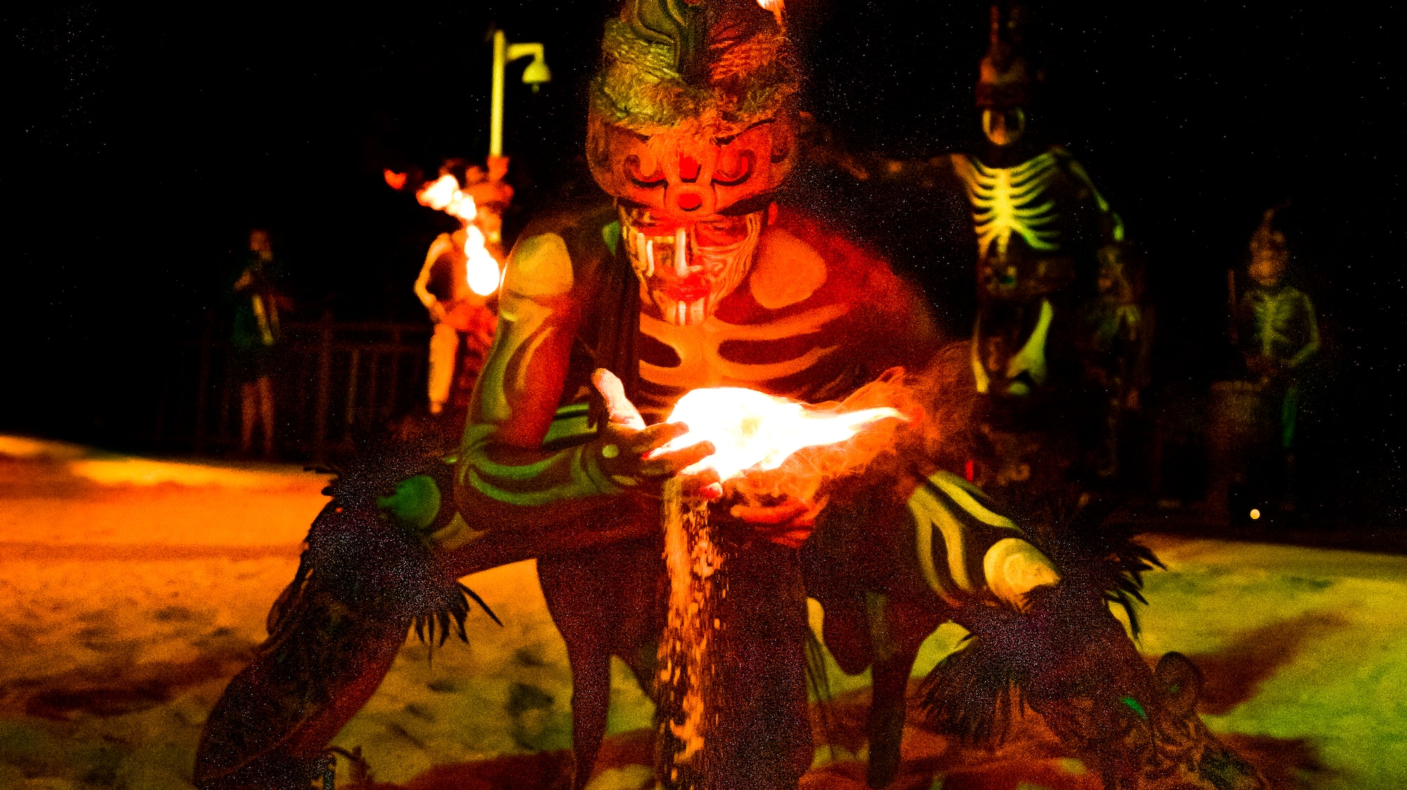 a man in garment with a fire in his hand