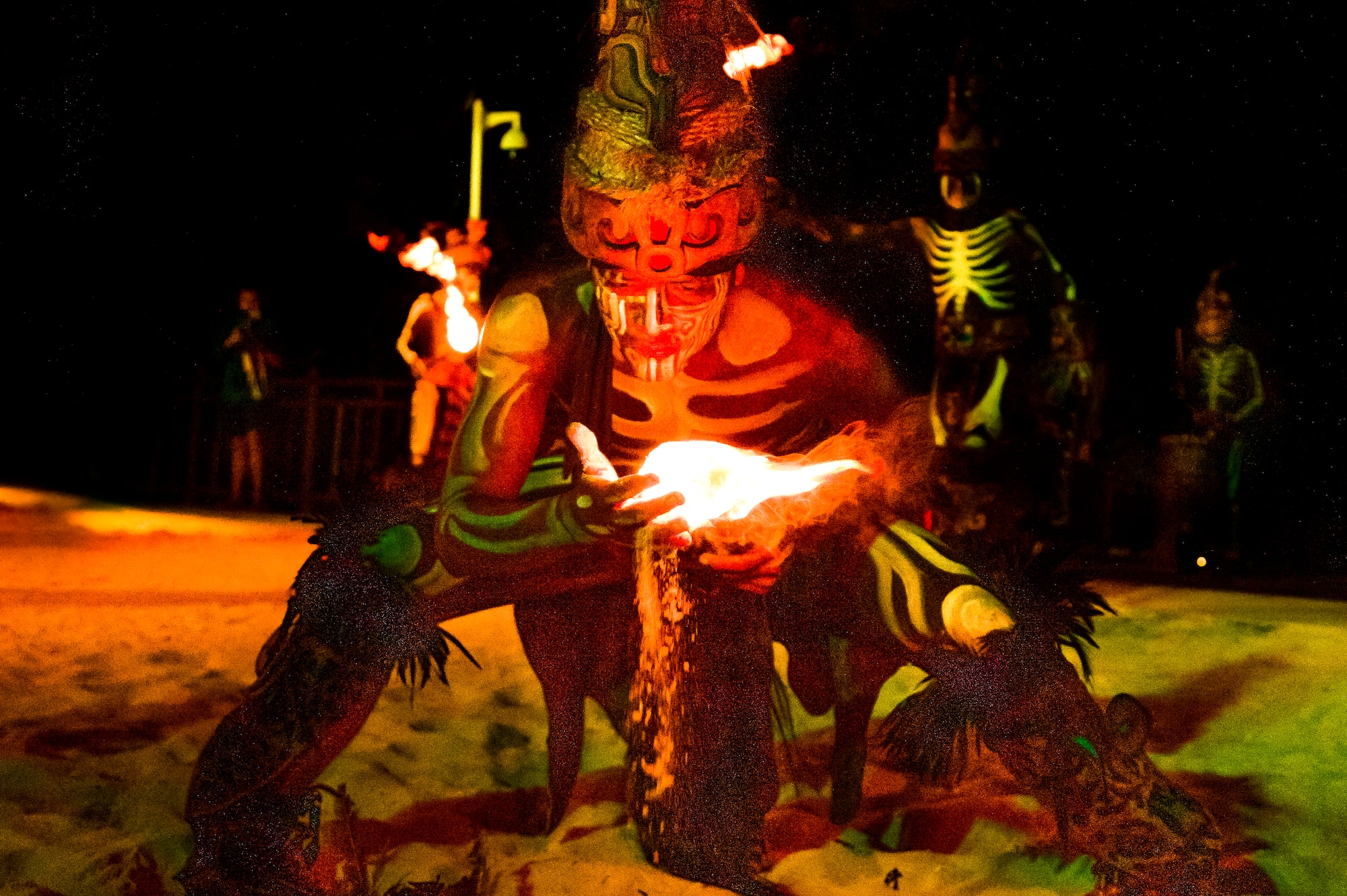 a man in garment with a fire in his hand