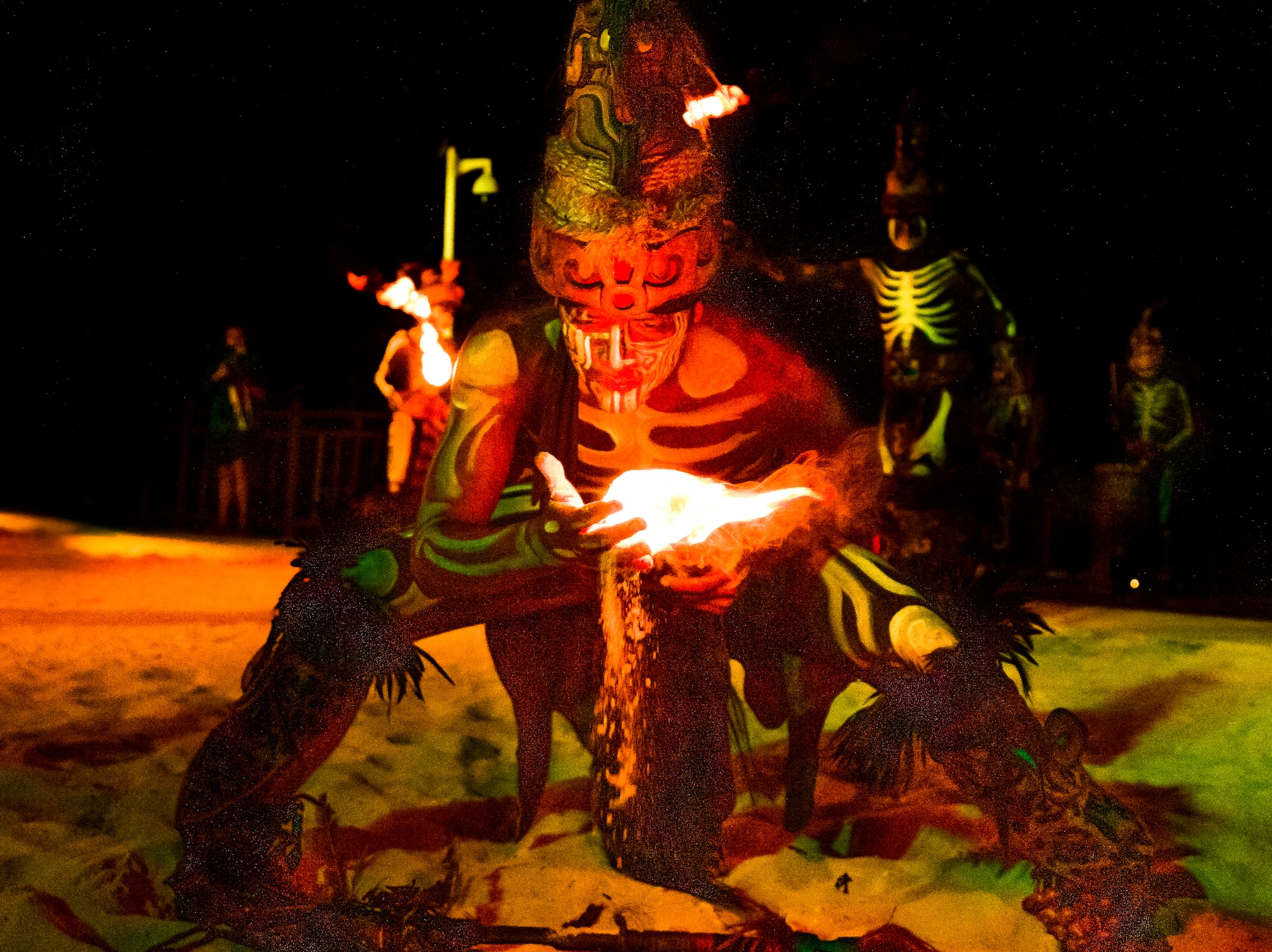 a man in garment with a fire in his hand