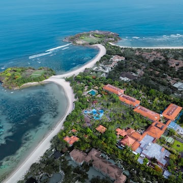 a aerial view of a beach and a building