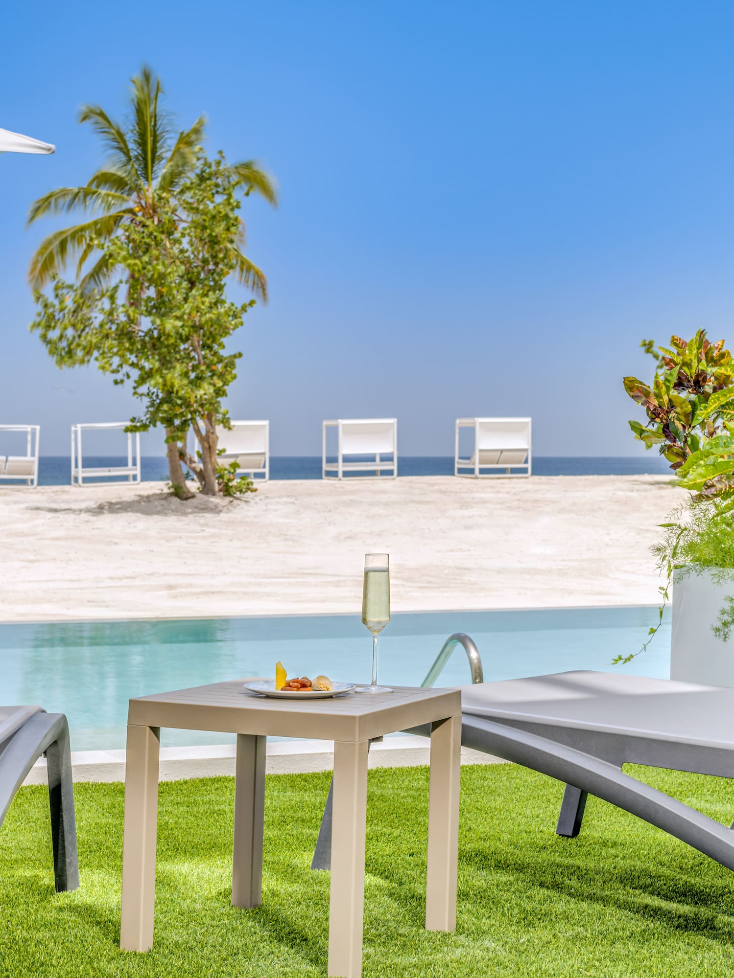 a pool with a table and chairs