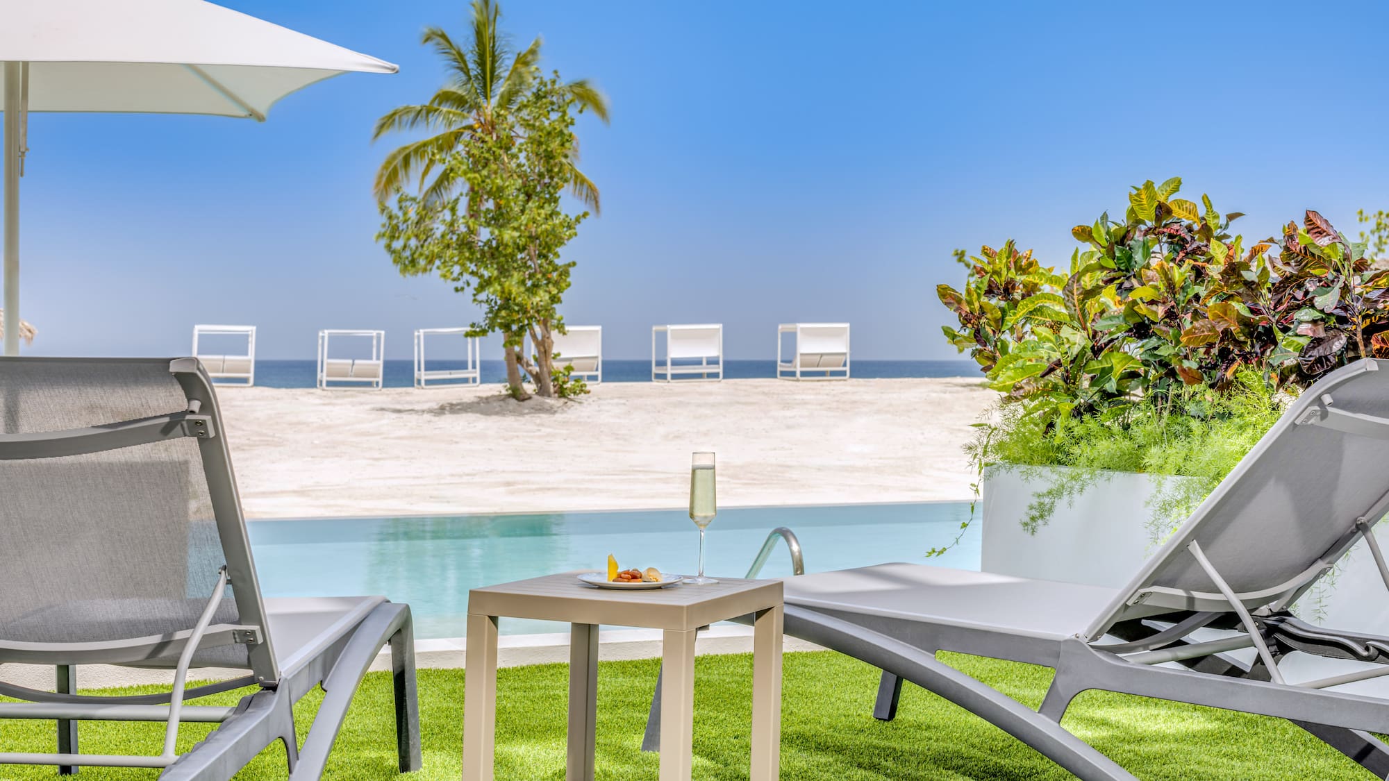 a pool with a table and chairs