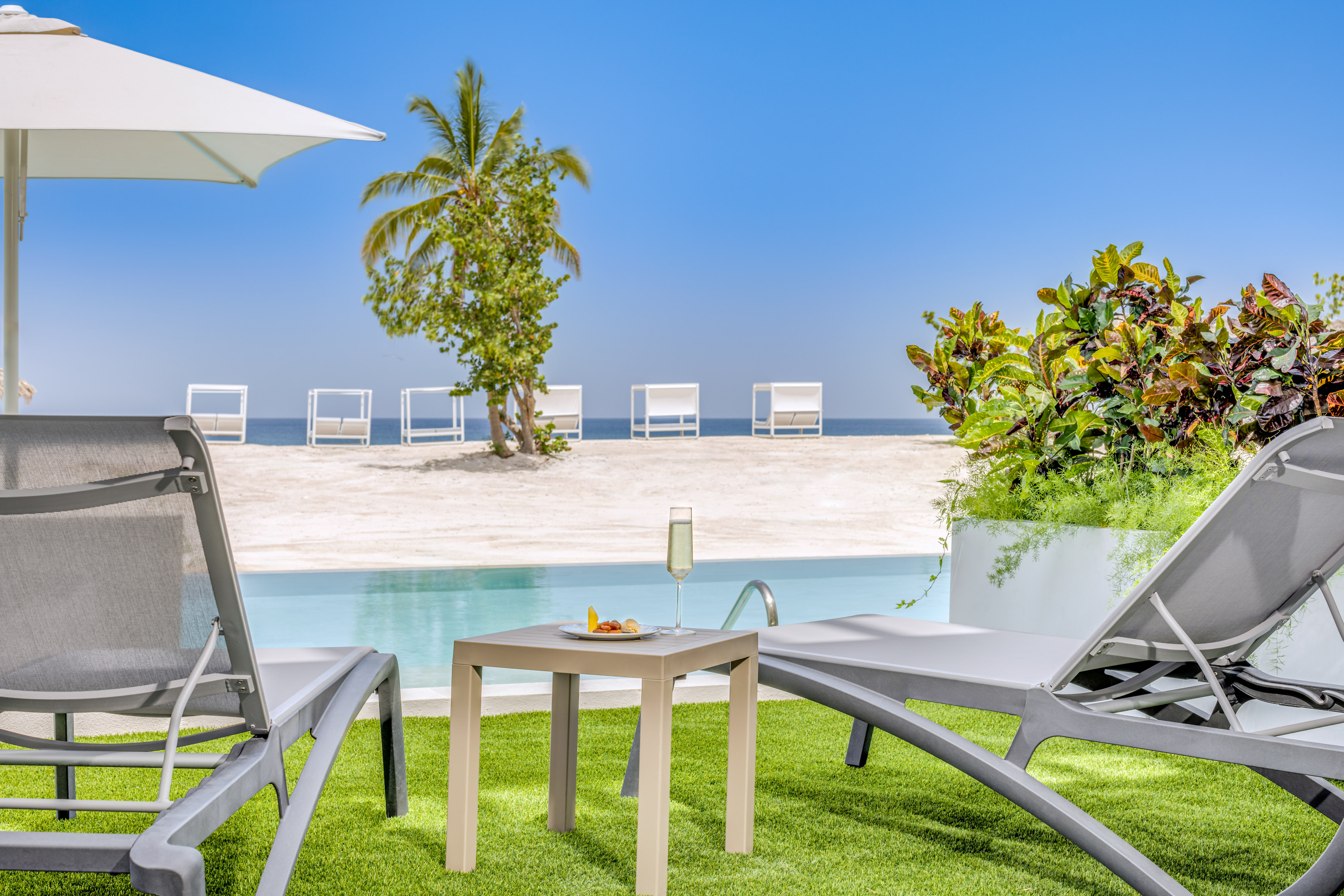 a pool with a table and chairs