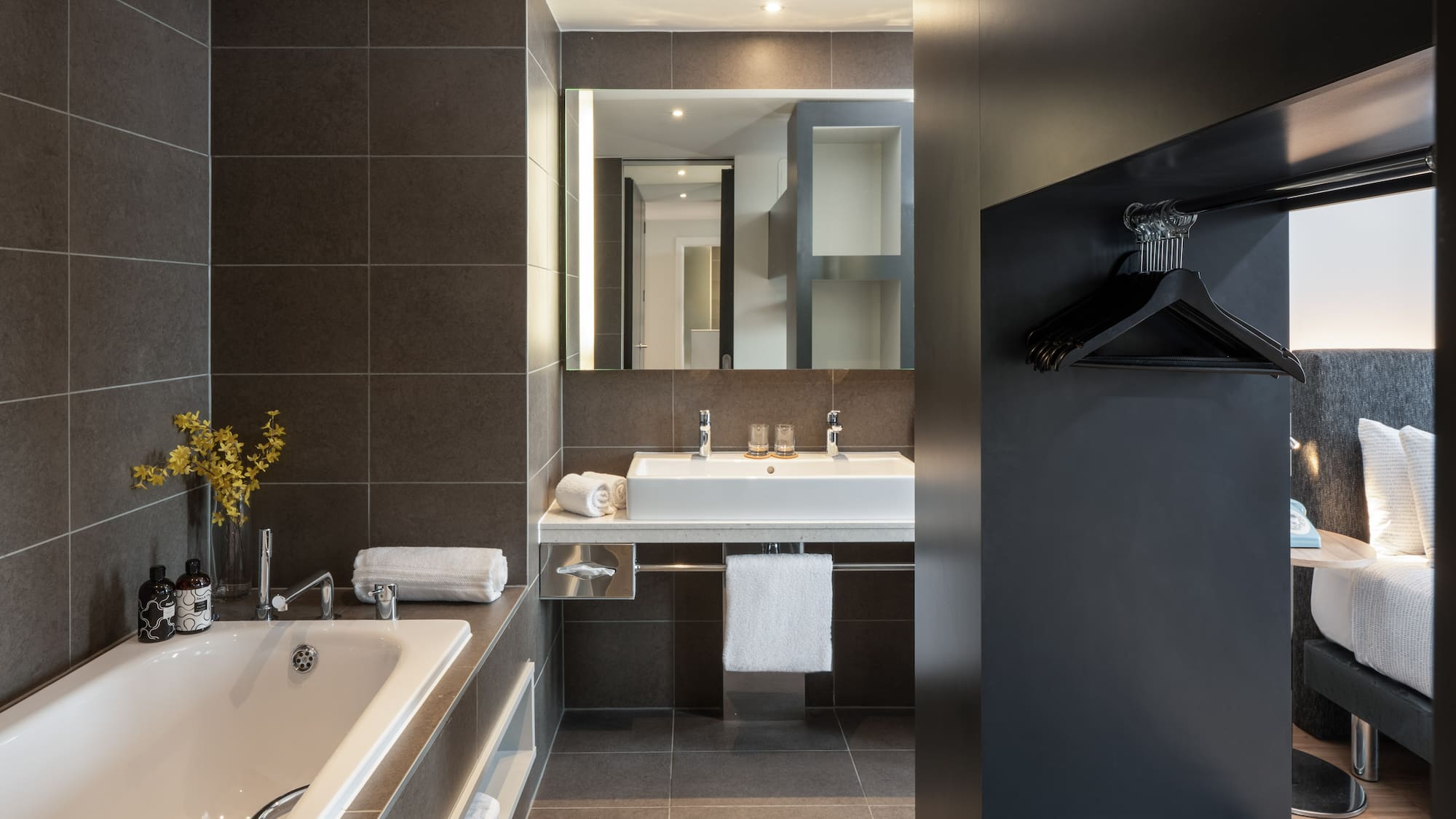 a bathroom with a bathtub and sink