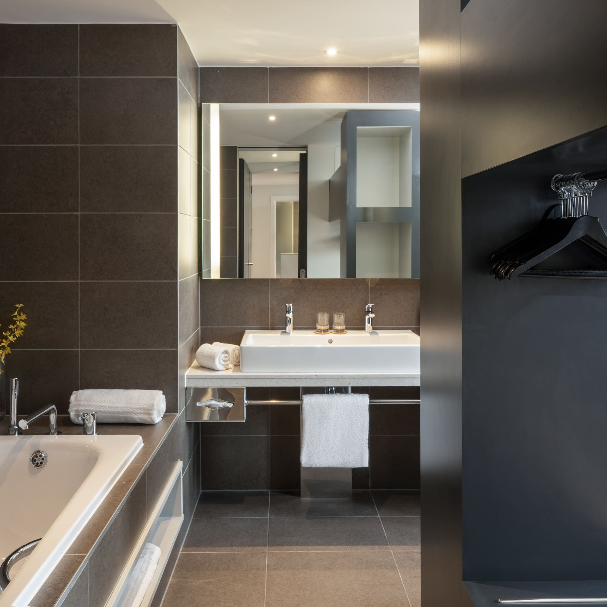 a bathroom with a bathtub and sink