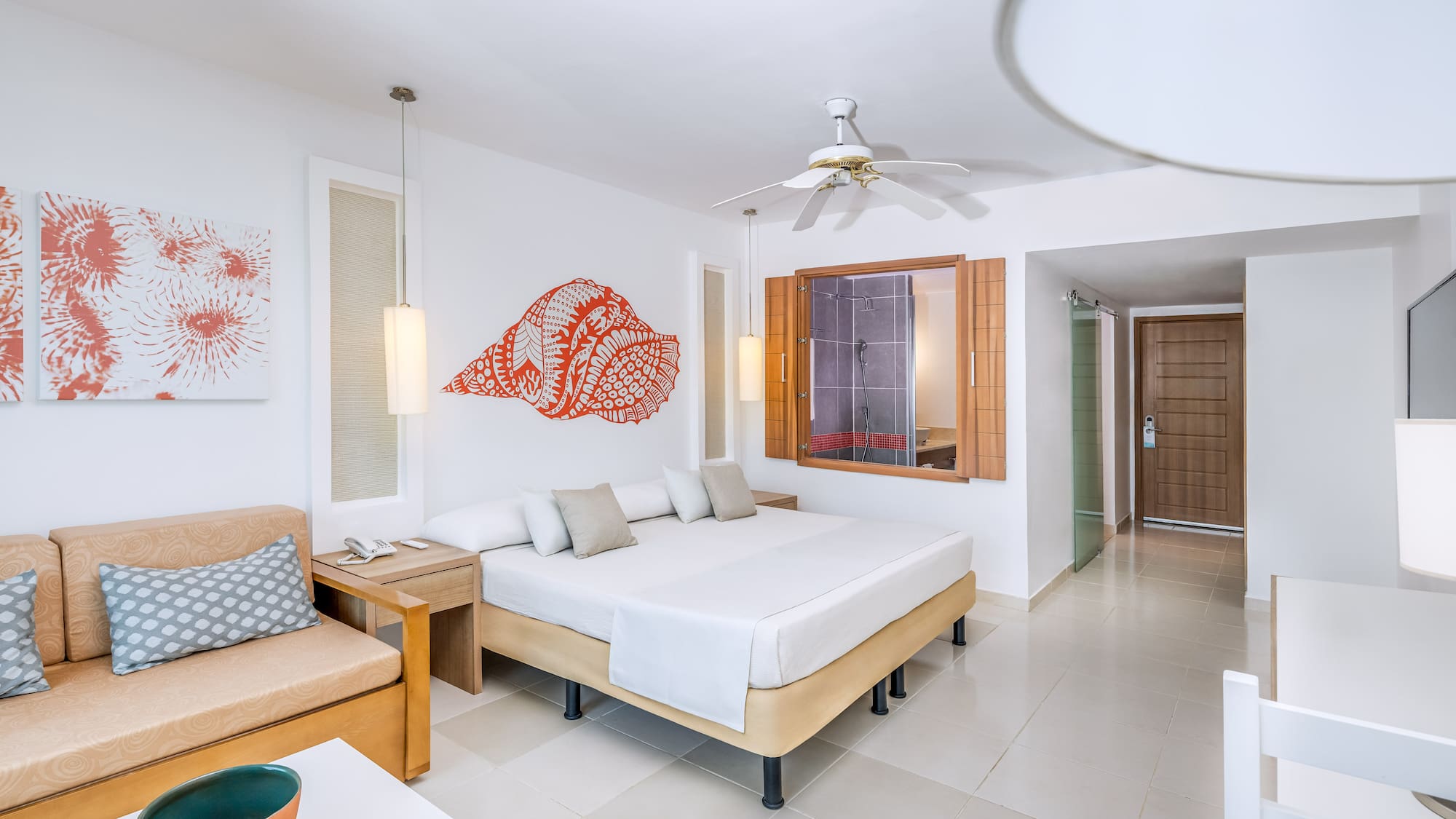 a room with a bed and a fan