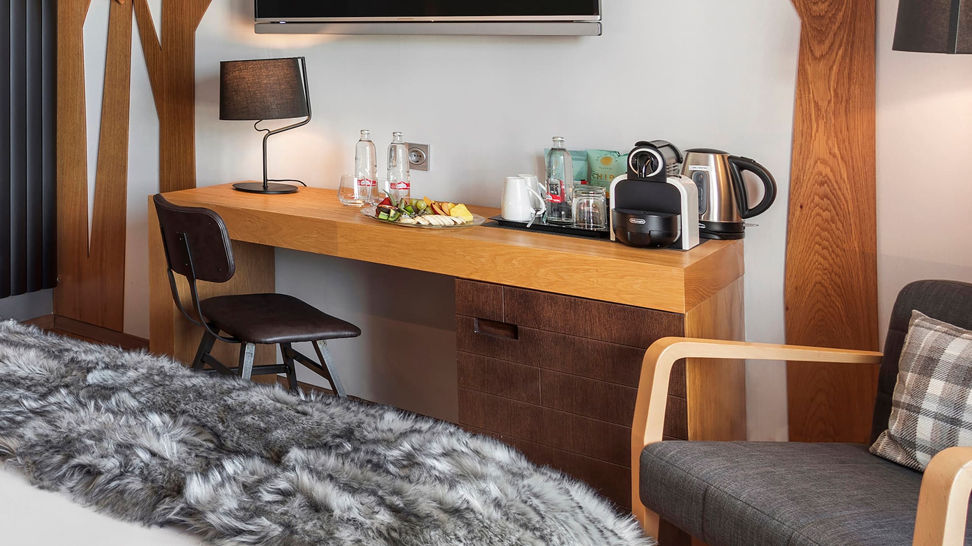 a room with a bed and a tv