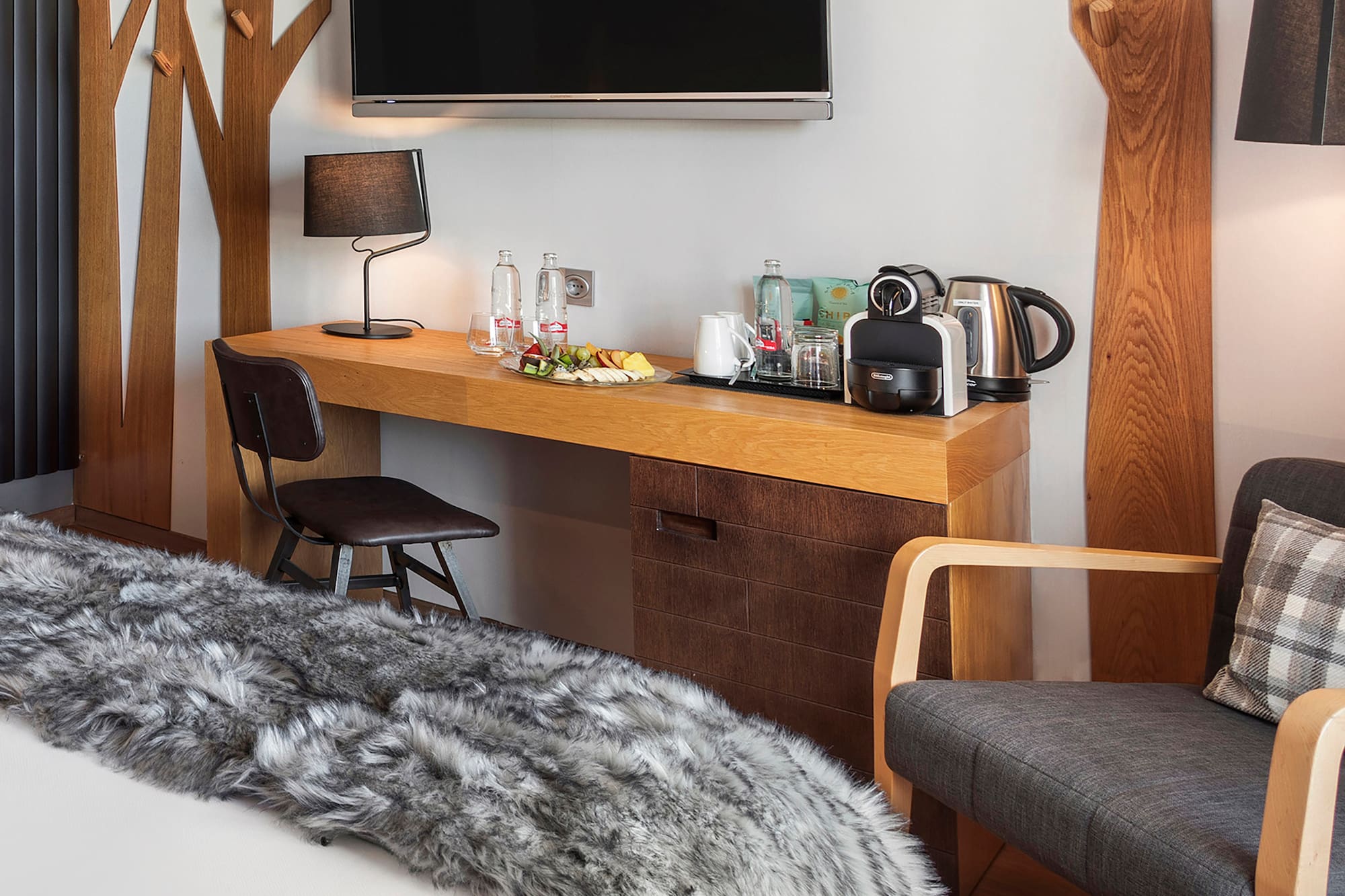 a room with a bed and a tv