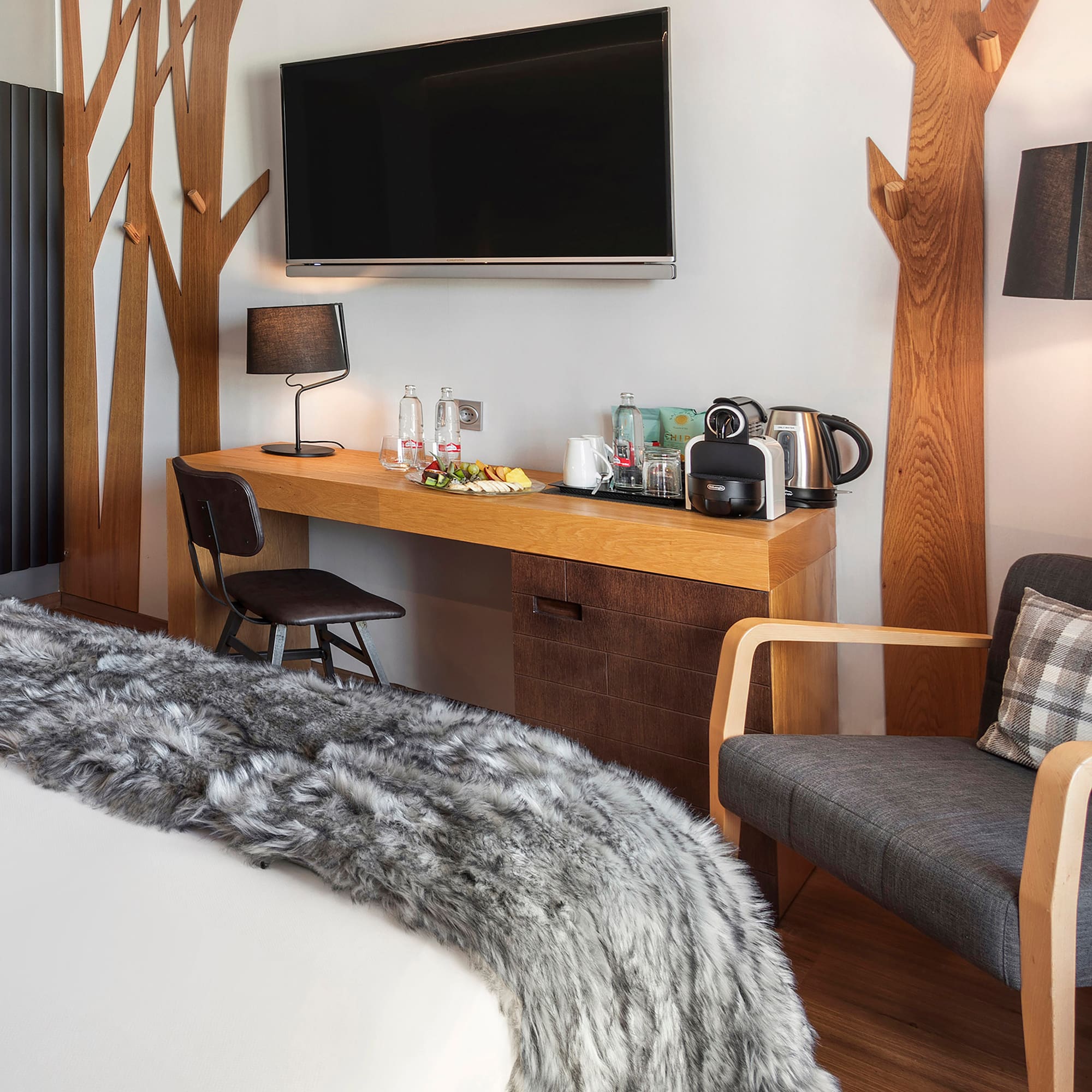 a room with a bed and a tv