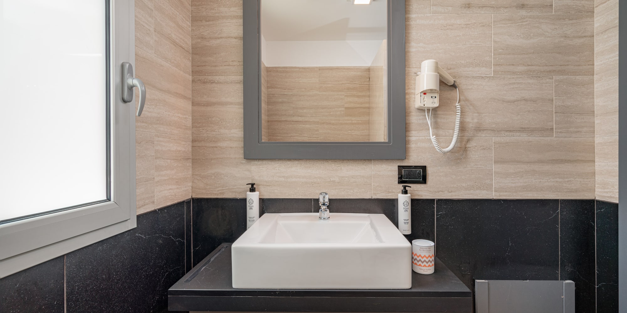 a bathroom with a mirror and sink