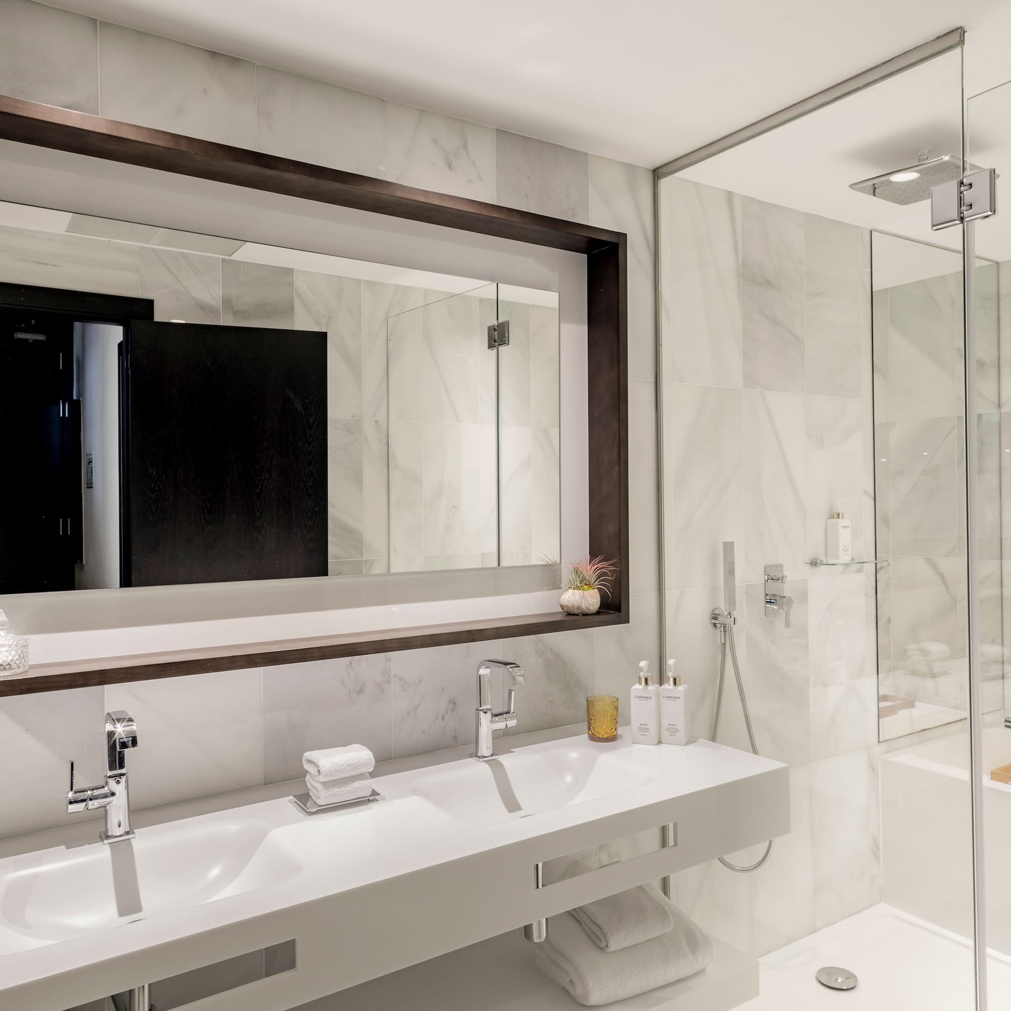 a bathroom with a mirror and sinks