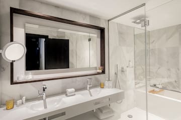 a bathroom with a mirror and sinks